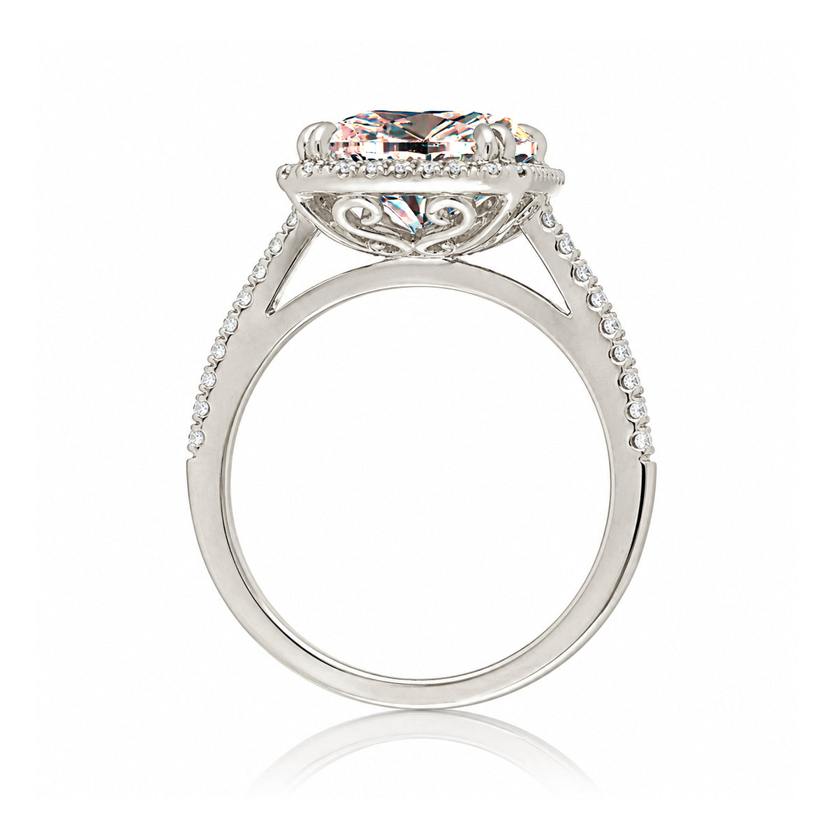 Emerald cut morganite ring with diamond halo in white gold