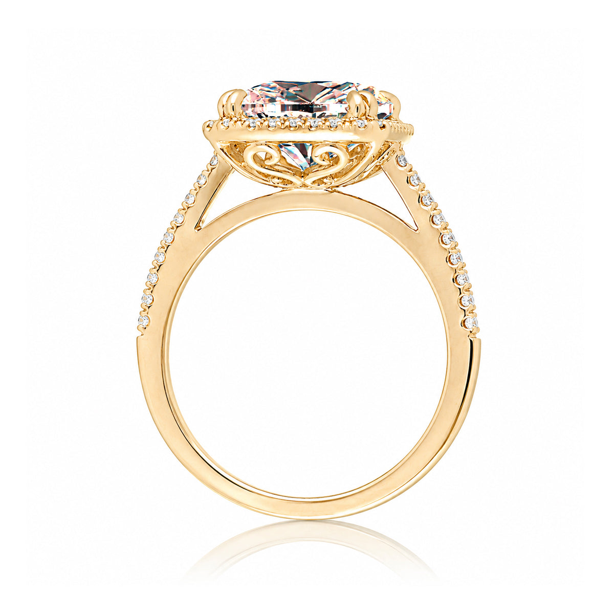 Emerald cut morganite ring with diamond halo in yellow gold