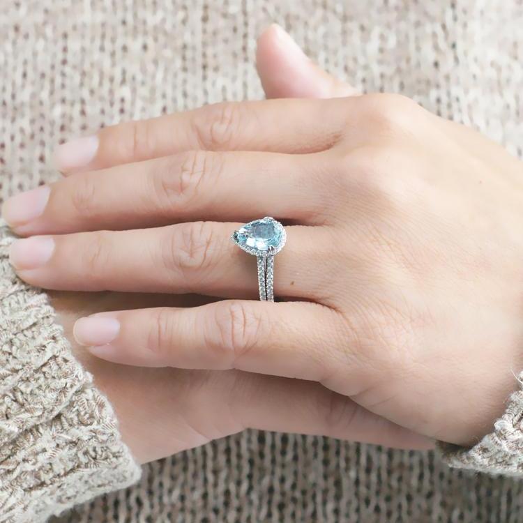 Pear aquamarine engagement ring with halo in white gold set