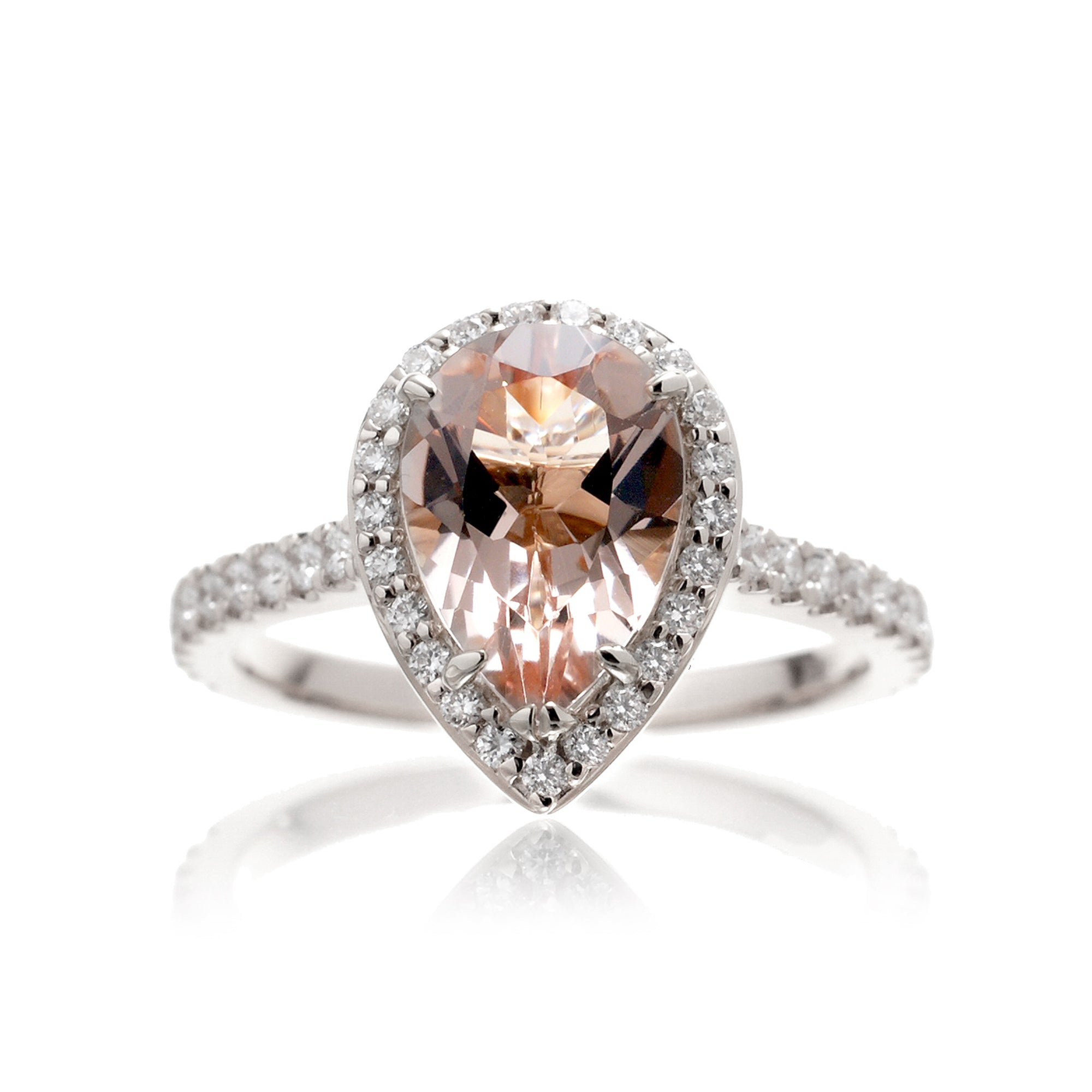 Pear cut morganite ring with diamond halo and band in the Sunset white gold