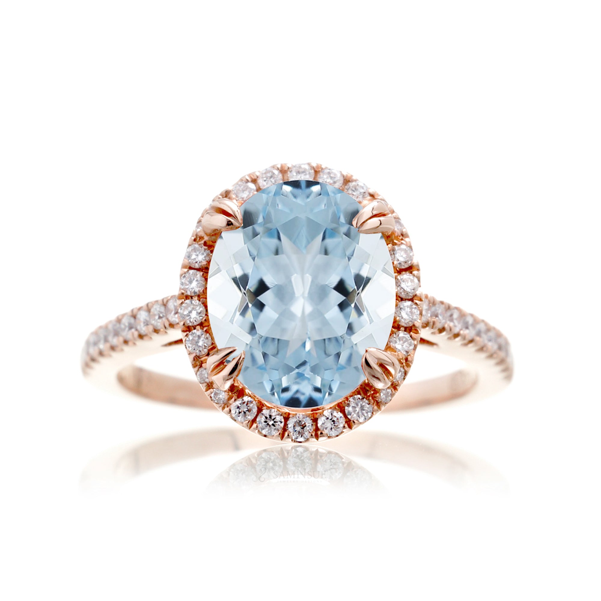 Oval cut aquamarine engagement ring with halo in rose gold