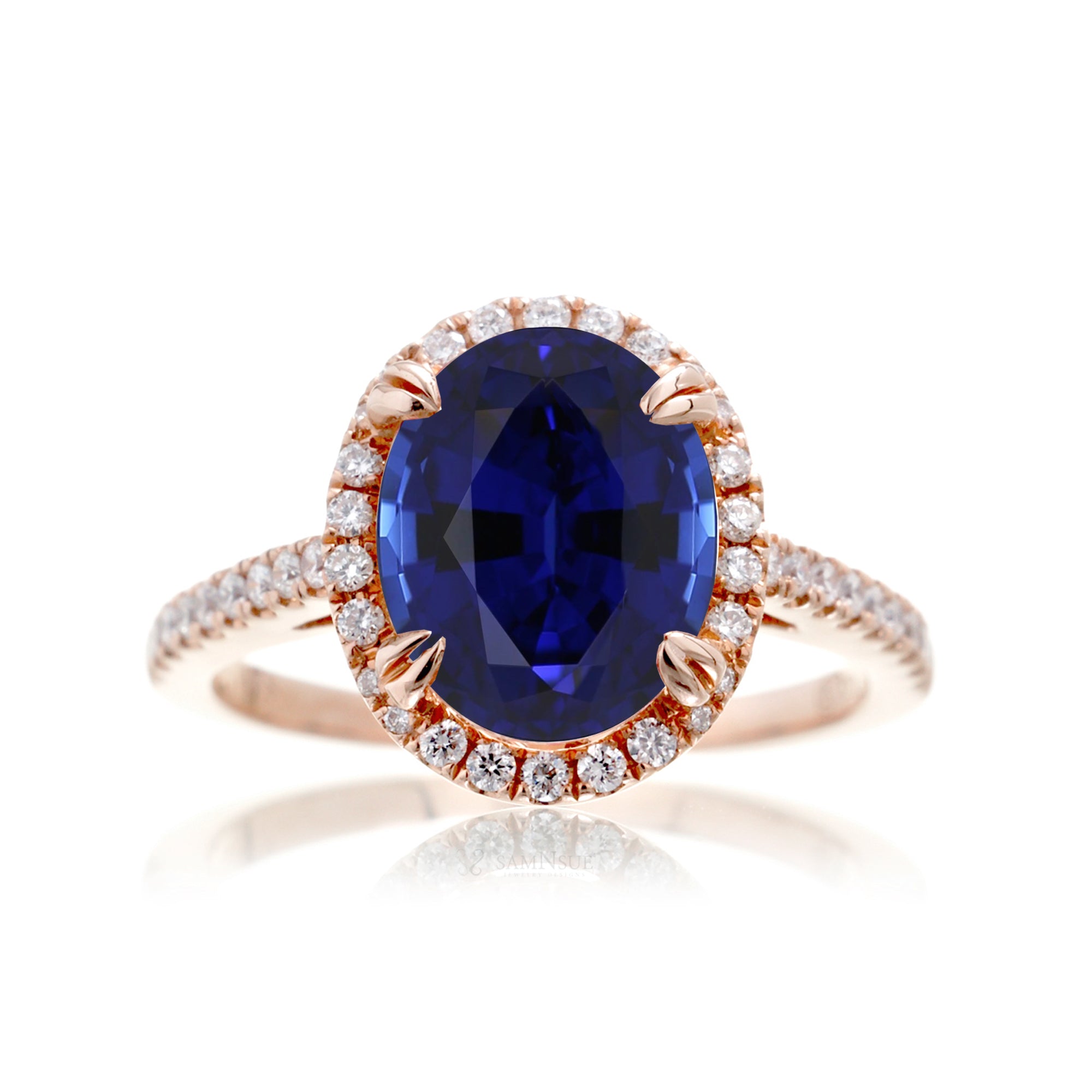 Oval shape blue sapphire ring with diamond halo in rose gold