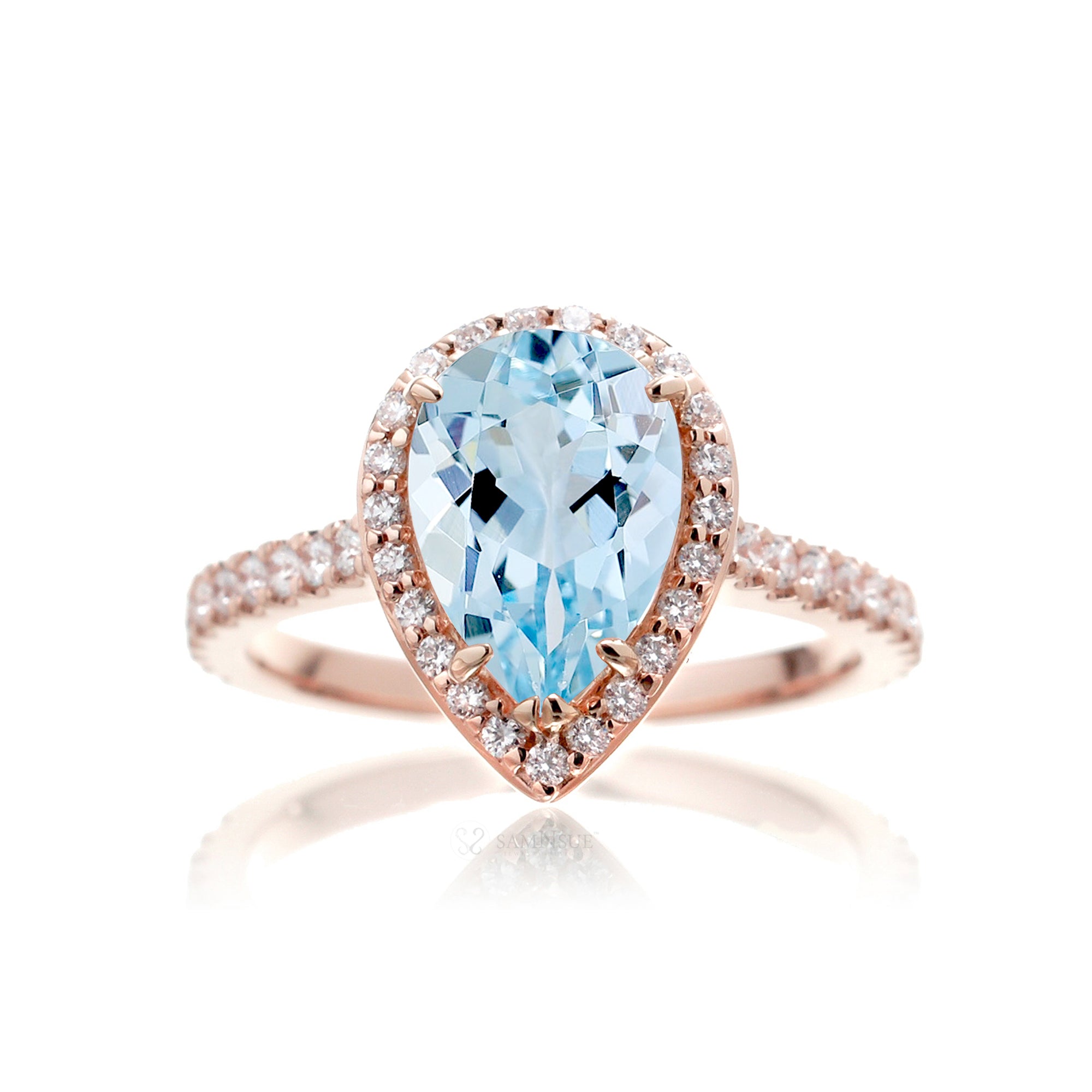 Pear aquamarine halo engagement ring in the Sunset rose gold