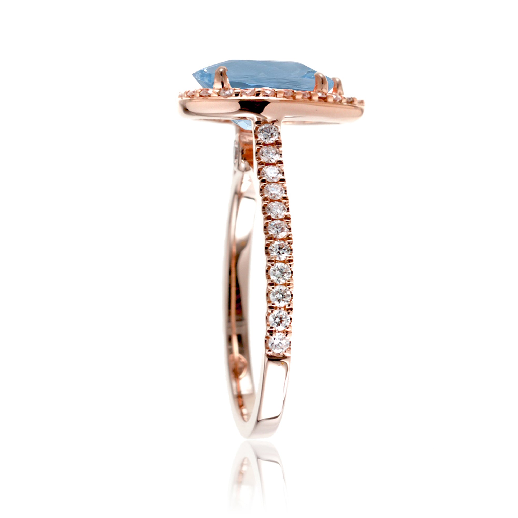 Pear aquamarine halo engagement ring in the Sunset rose gold