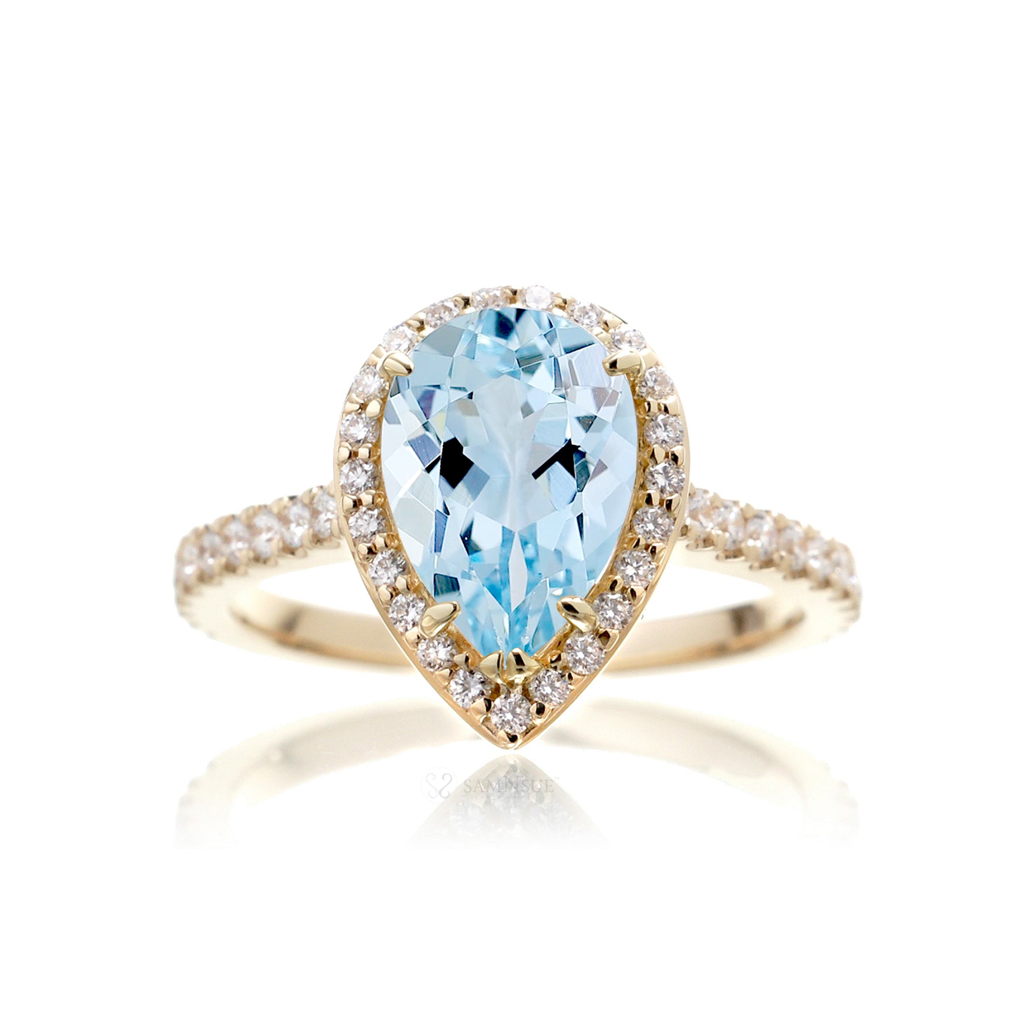 Pear aquamarine halo engagement ring in the Sunset yellow gold