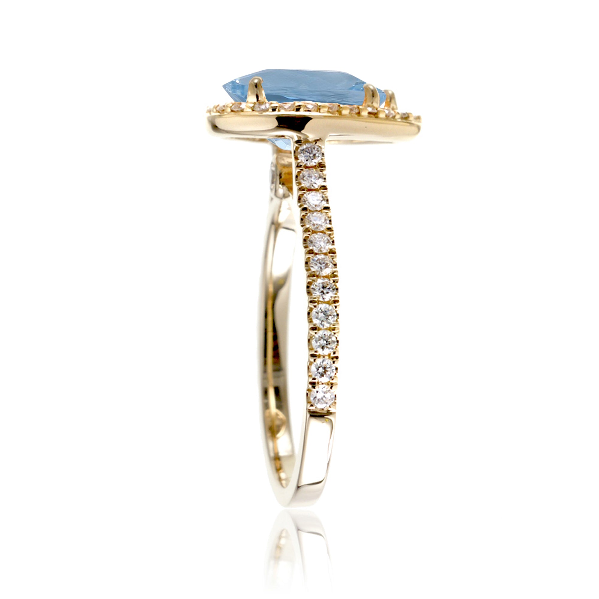 Pear aquamarine halo engagement ring in the Sunset yellow gold