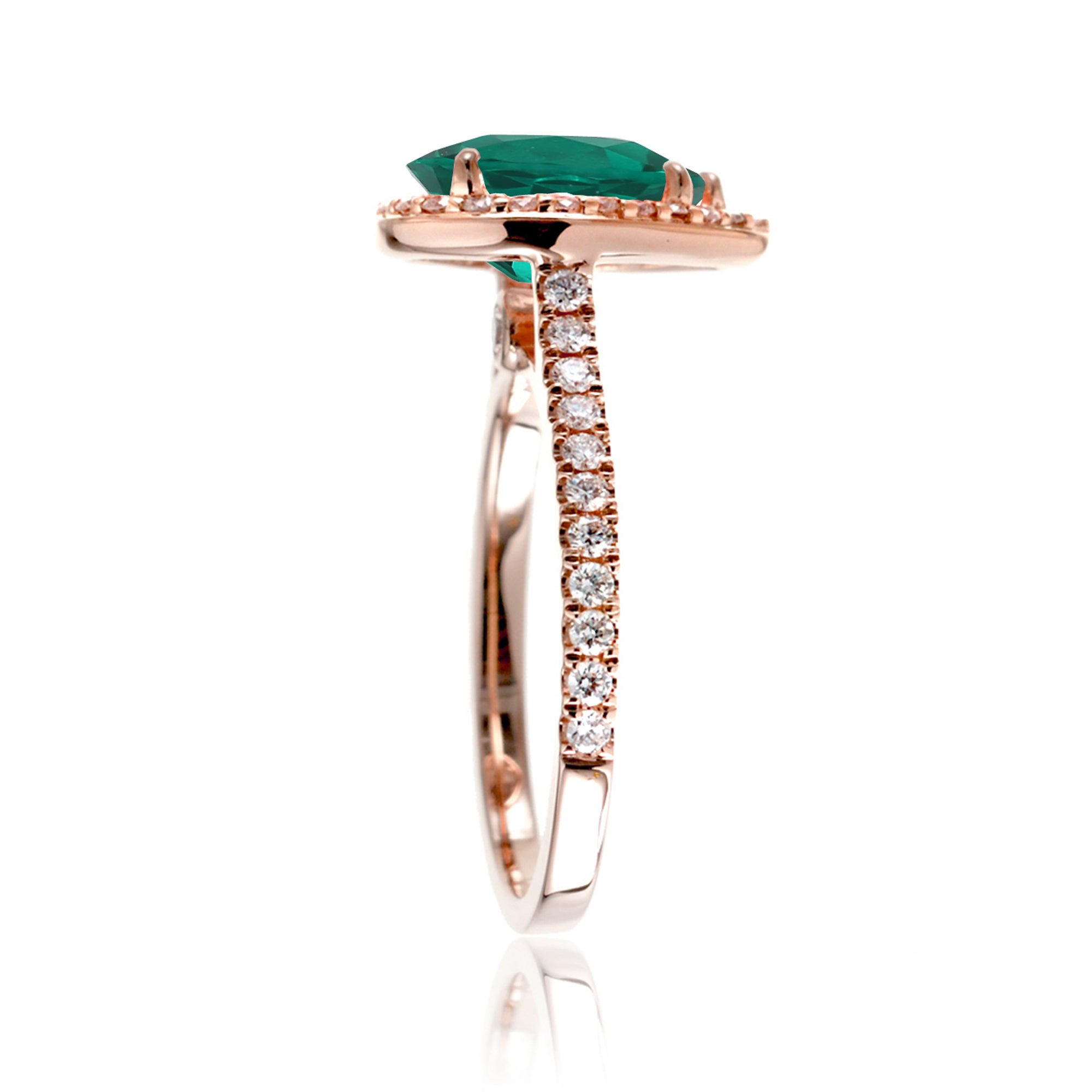 Pear emerald with diamond halo and band hidden bezel in rose gold