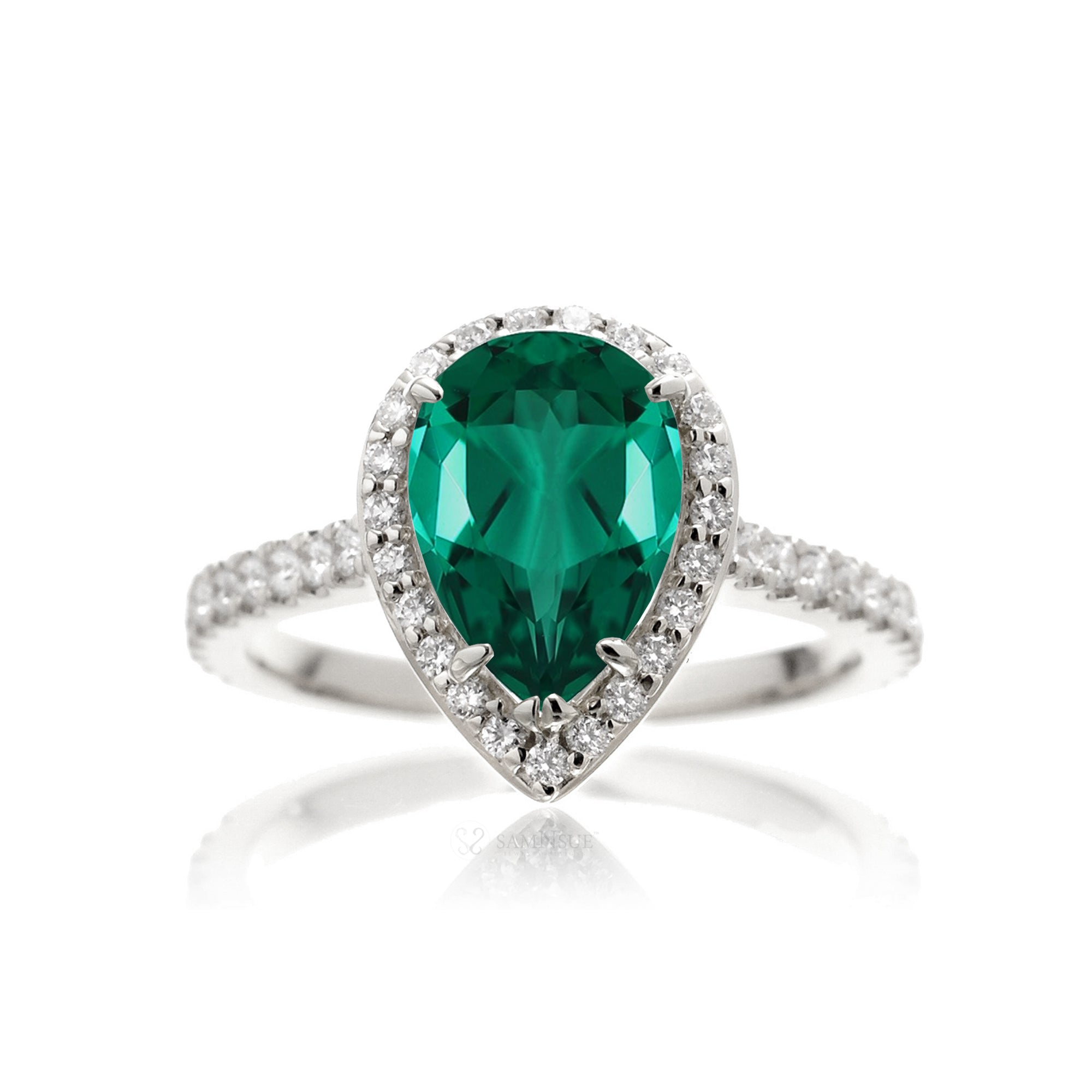 Pear emerald with diamond halo and band hidden bezel in white gold