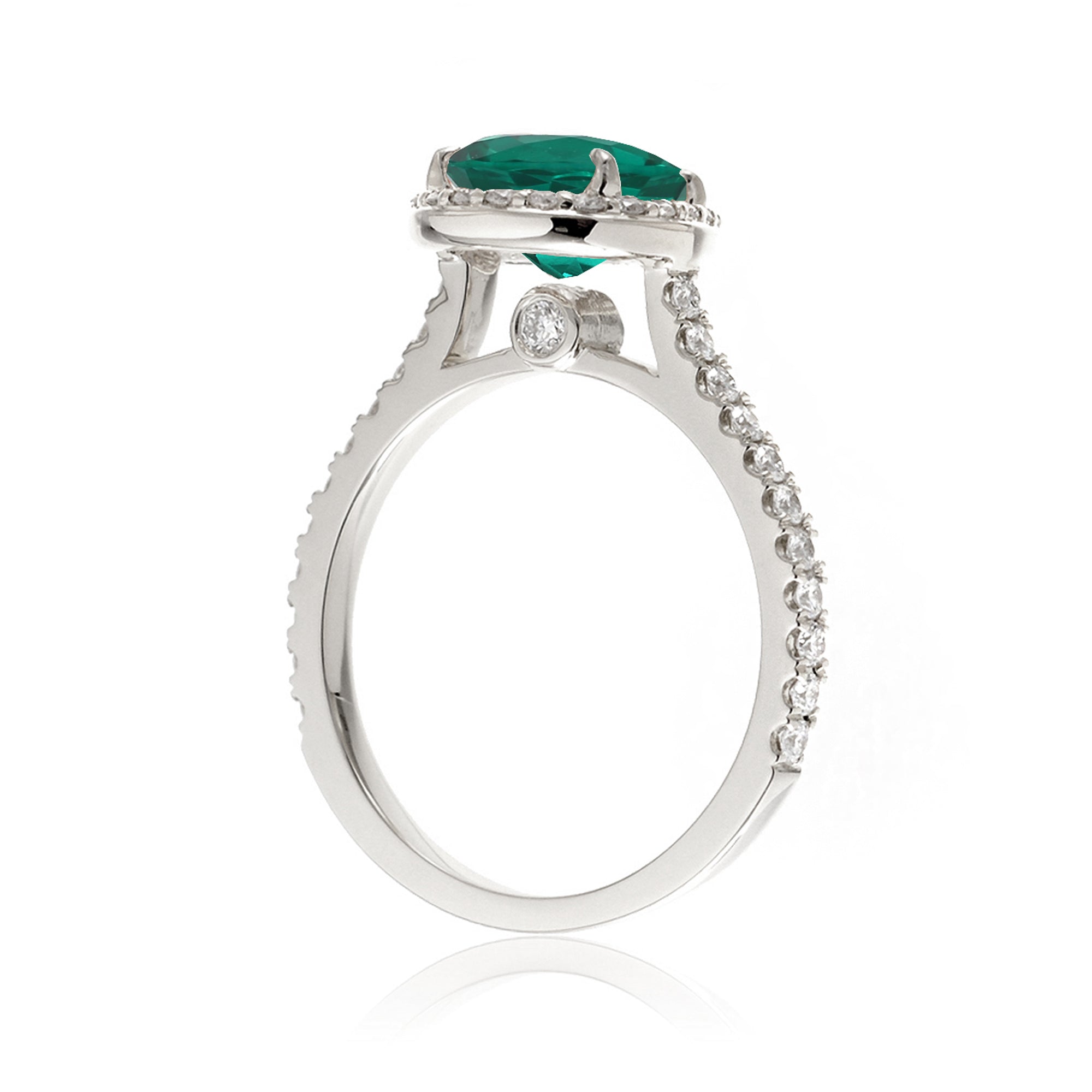 Pear emerald with diamond halo and band hidden bezel in white gold