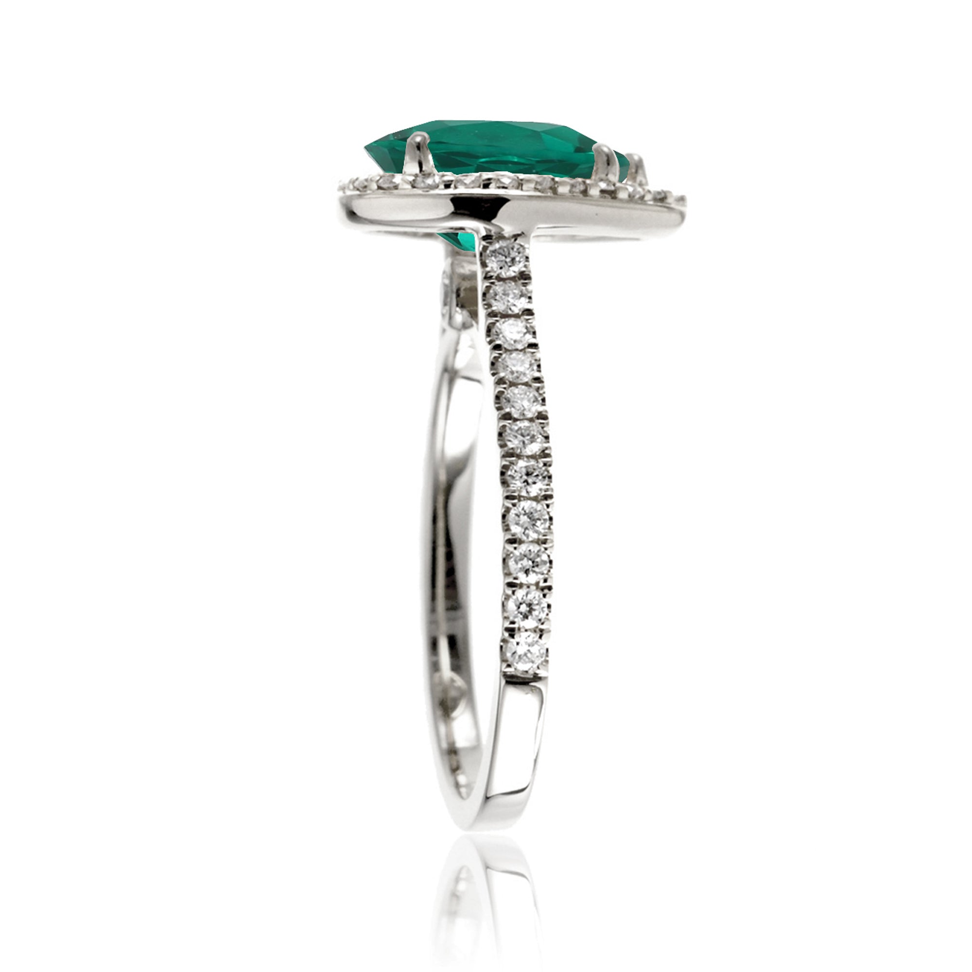 Pear emerald with diamond halo and band hidden bezel in white gold