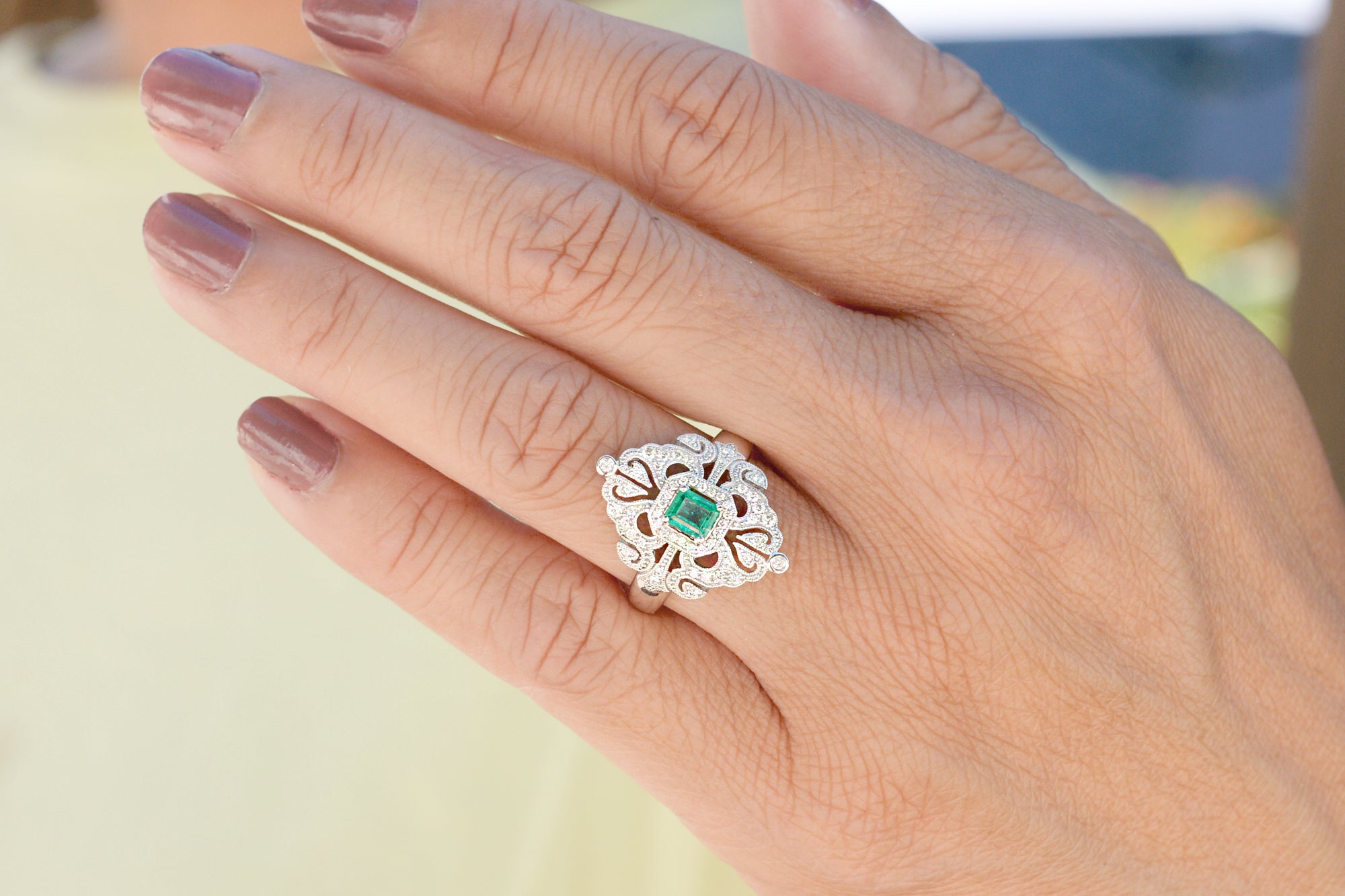 Vintage emerald and diamond ring in white gold