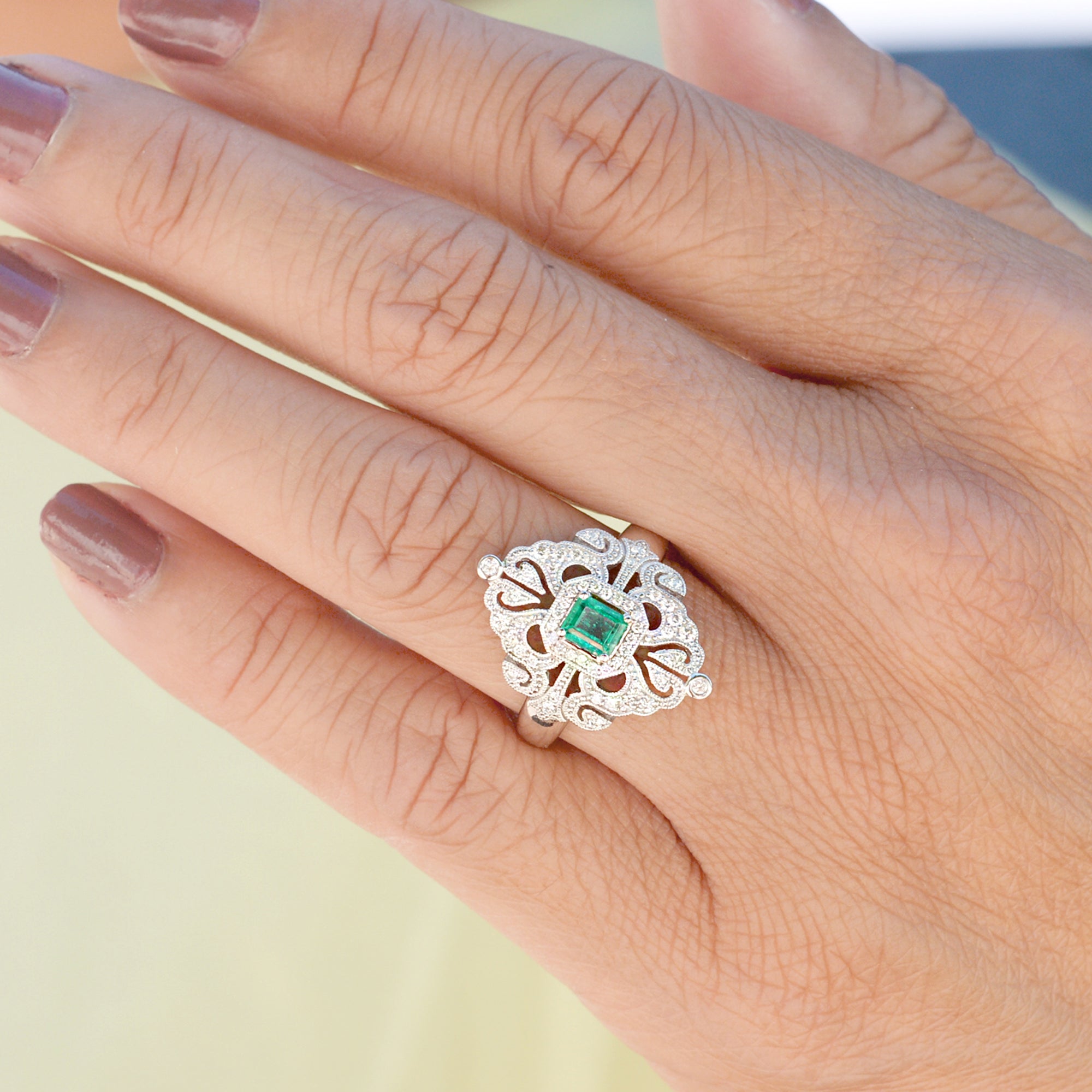 Vintage emerald and diamond ring in white gold