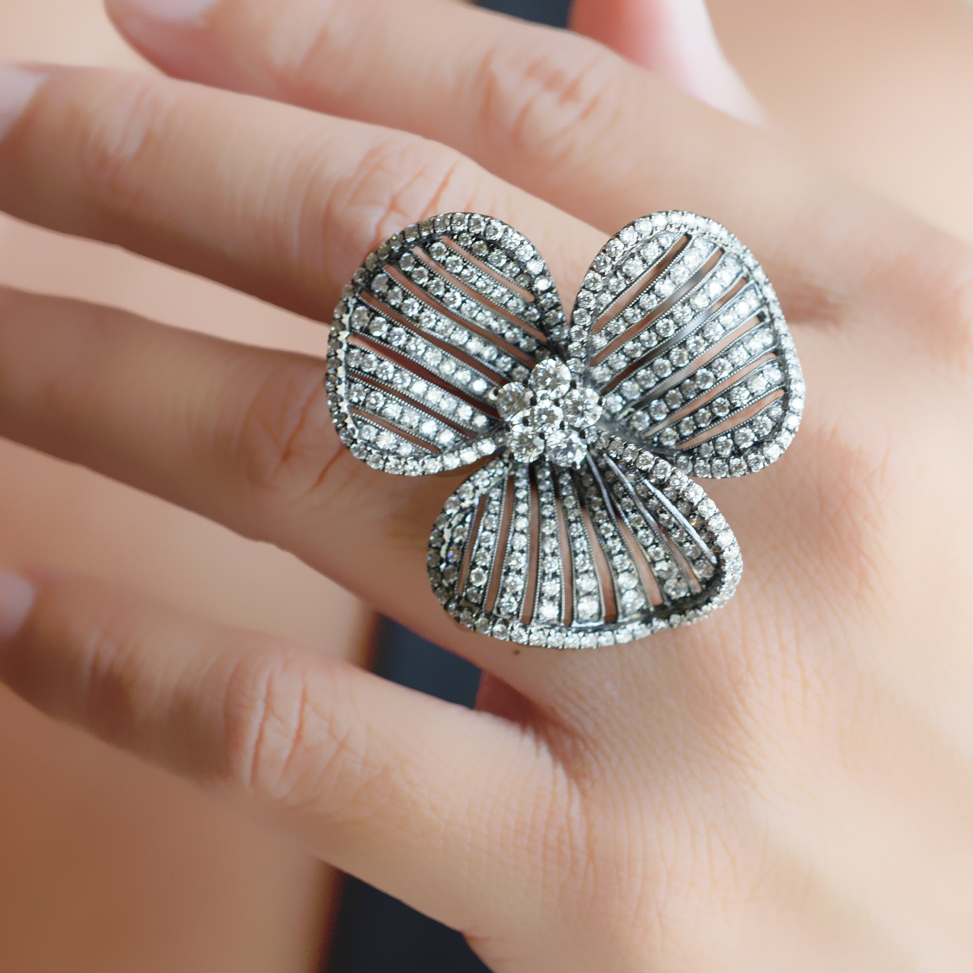 Three petal flower diamond ring cocktail with black rhodium in white gold