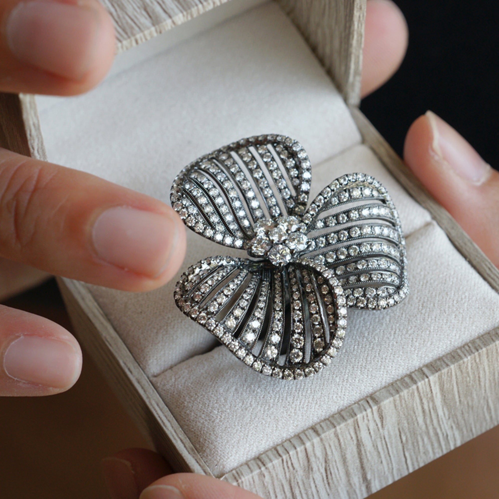 Three petal flower diamond ring cocktail with black rhodium in white gold