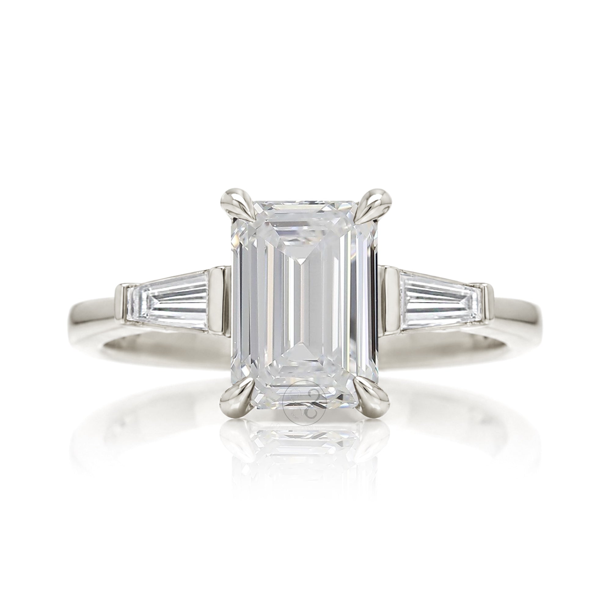 Emerald cut diamond three stone baguette ring
