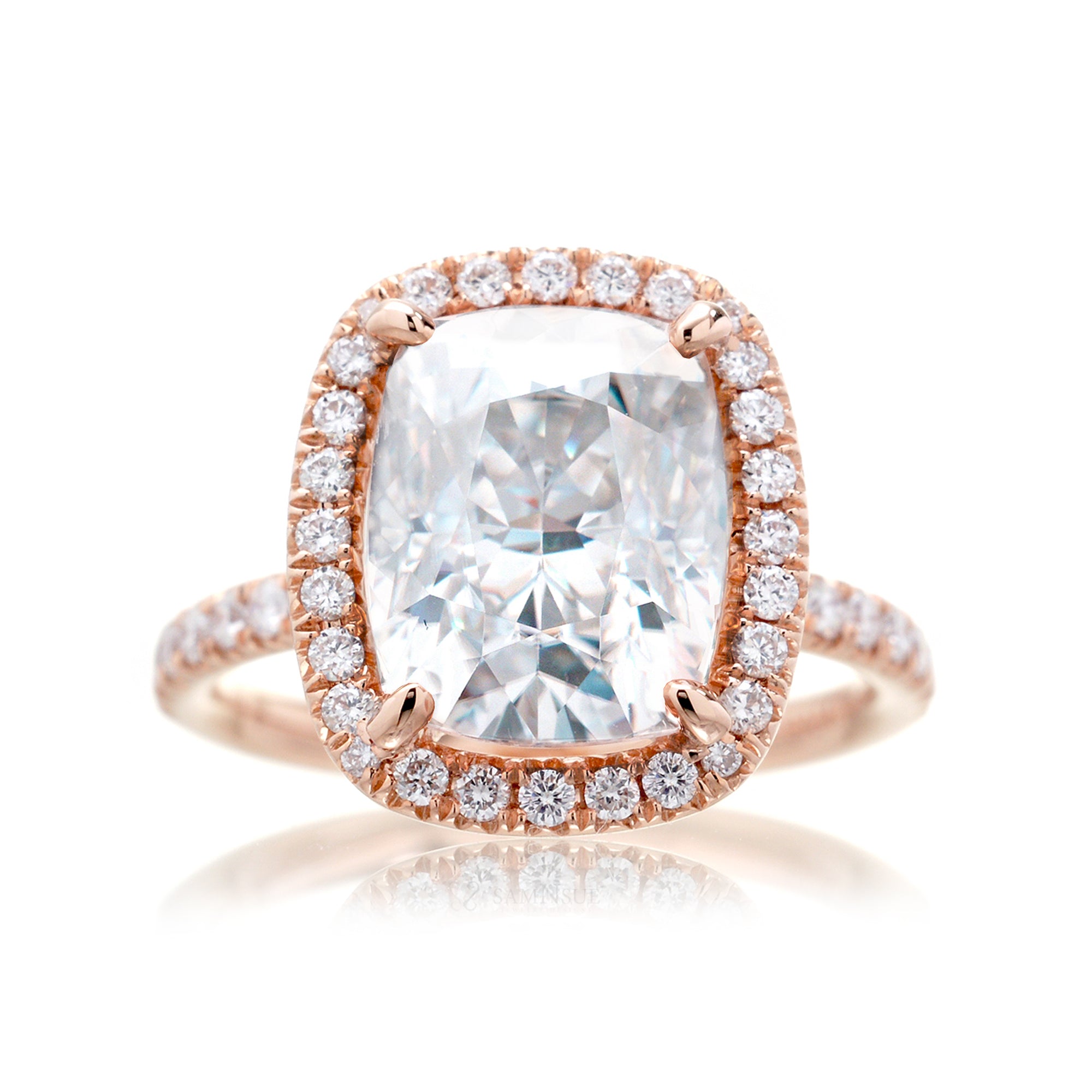 Cushion moissanite and diamond halo ring with a diamond band in rose gold - the drenched