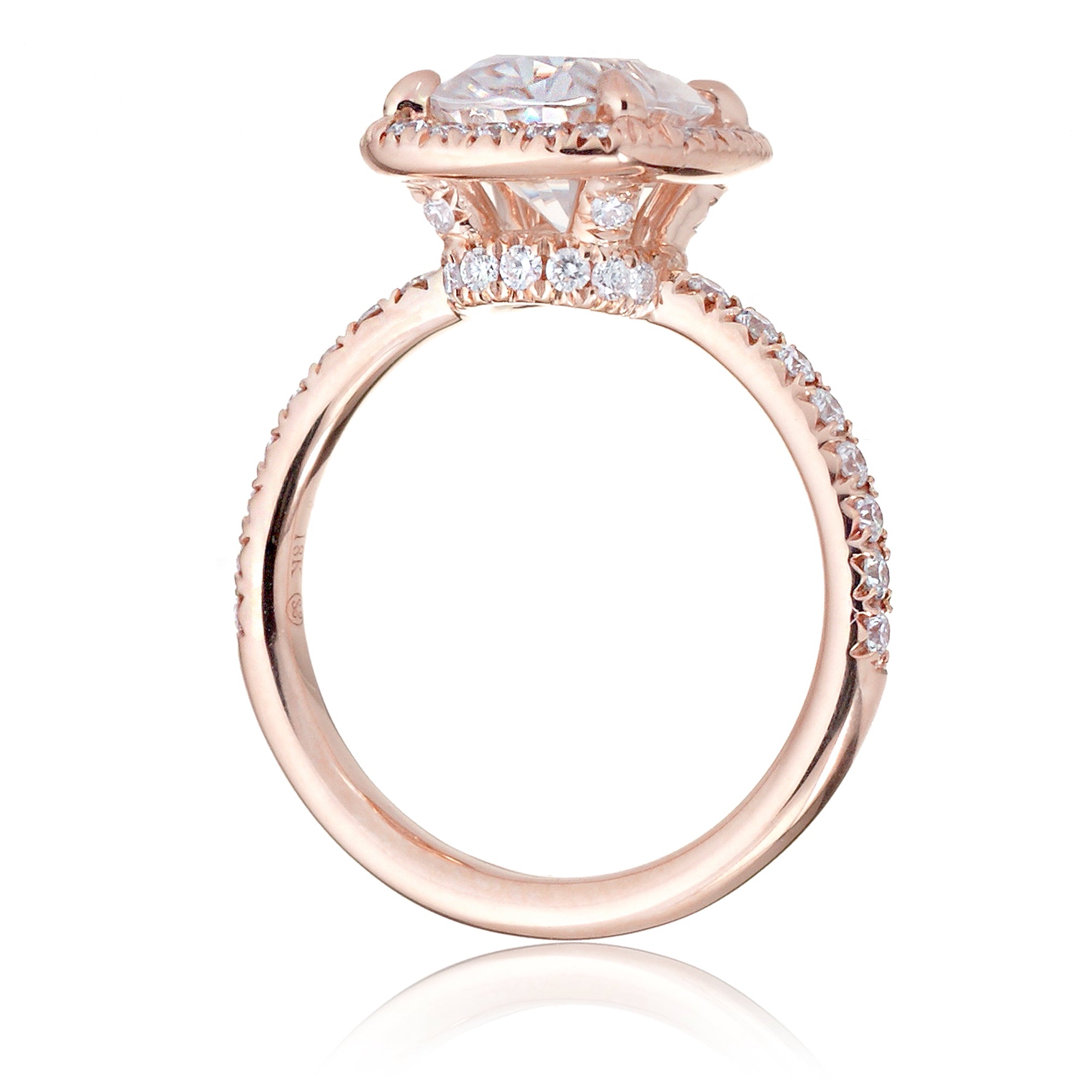 Cushion moissanite and diamond halo ring with a diamond band in rose gold - the drenched