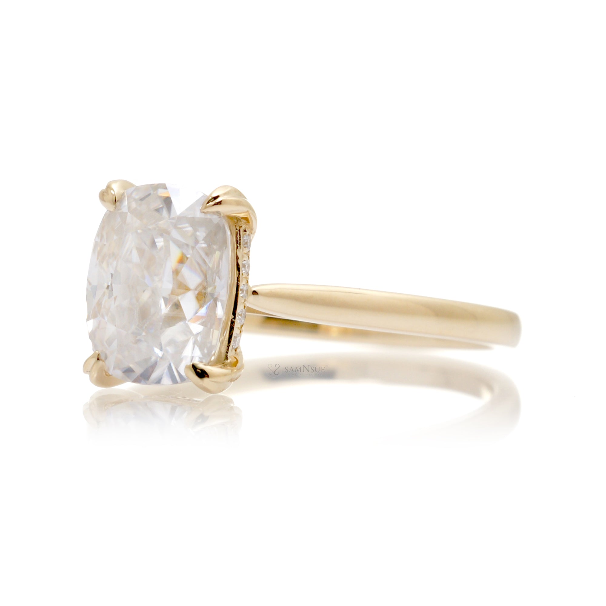 Cushion moissanite solitaire engagement ring in yellow gold and solid band