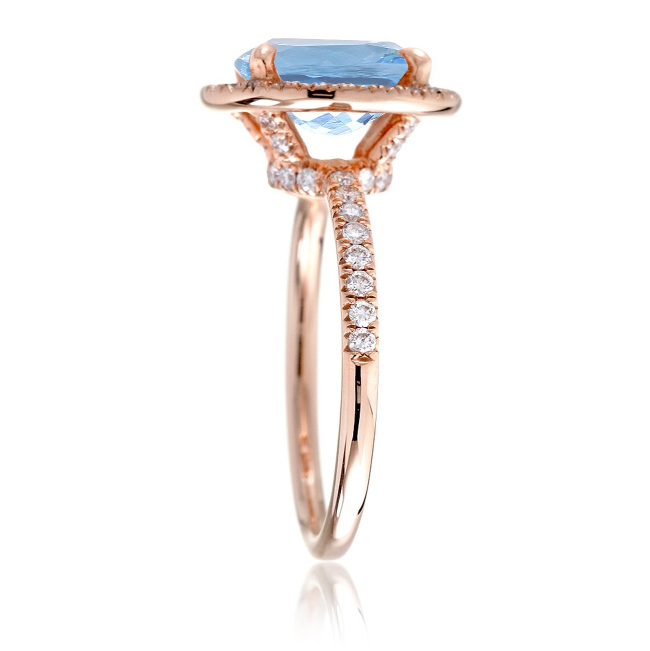 Oval aquamarine engagement ring with diamond halo the Drenched rose gold profile view