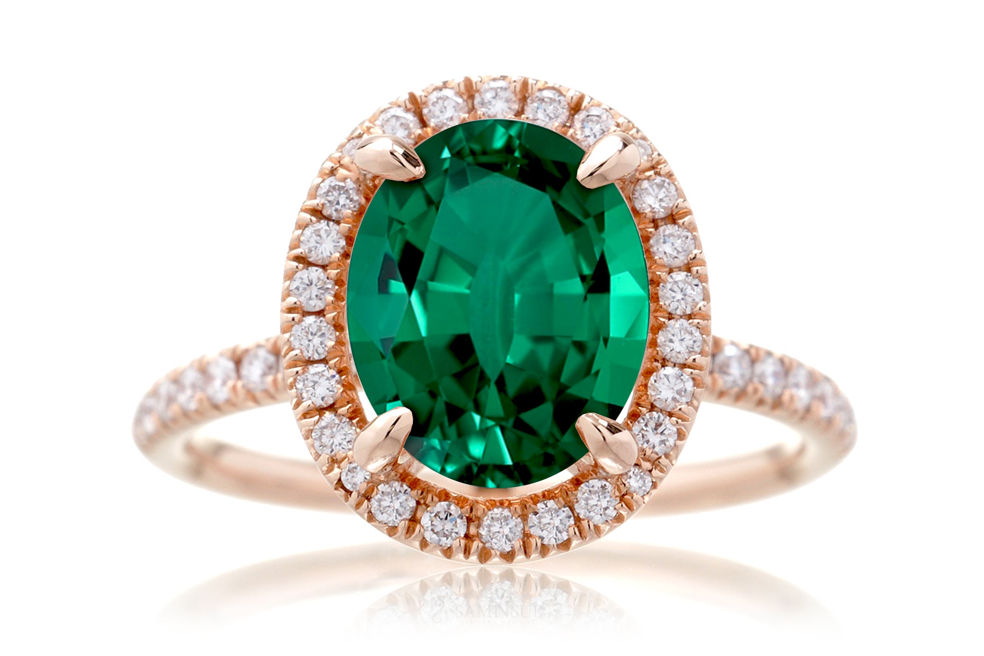 Oval cut emerald engagement ring with diamond halo the Drenched rose gold