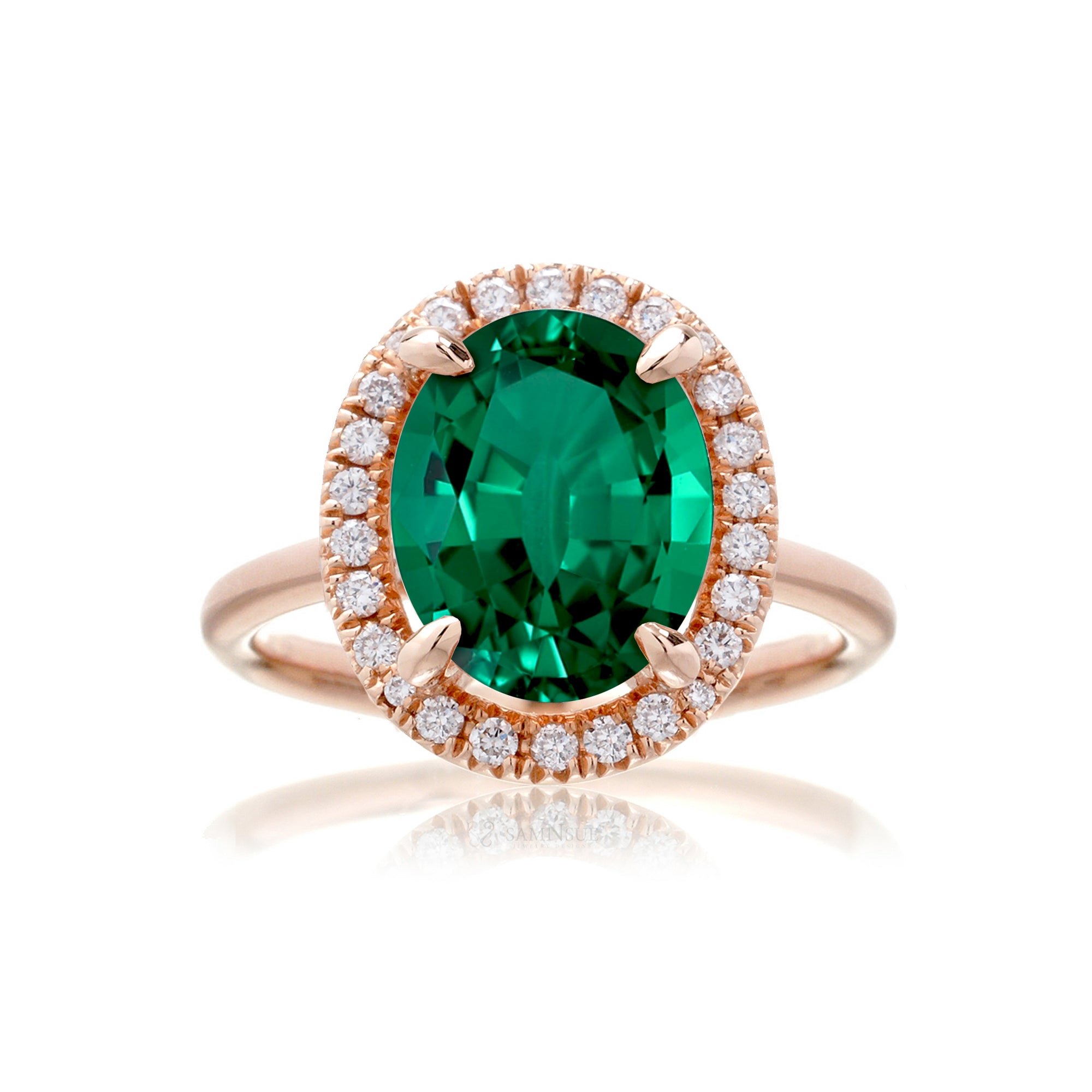 Oval cut emerald engagement ring with diamond halo the Drenched rose gold solid band