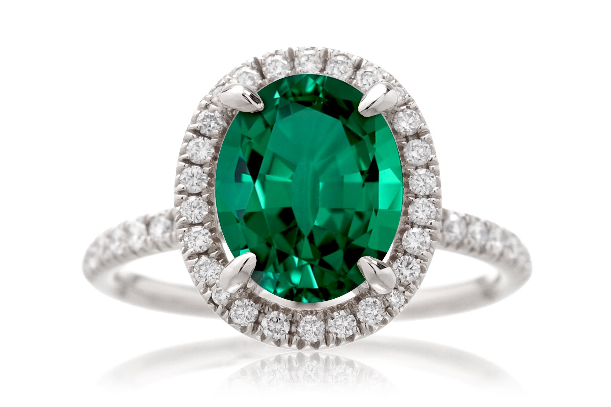 Oval cut emerald engagement ring with diamond halo the Drenched white gold