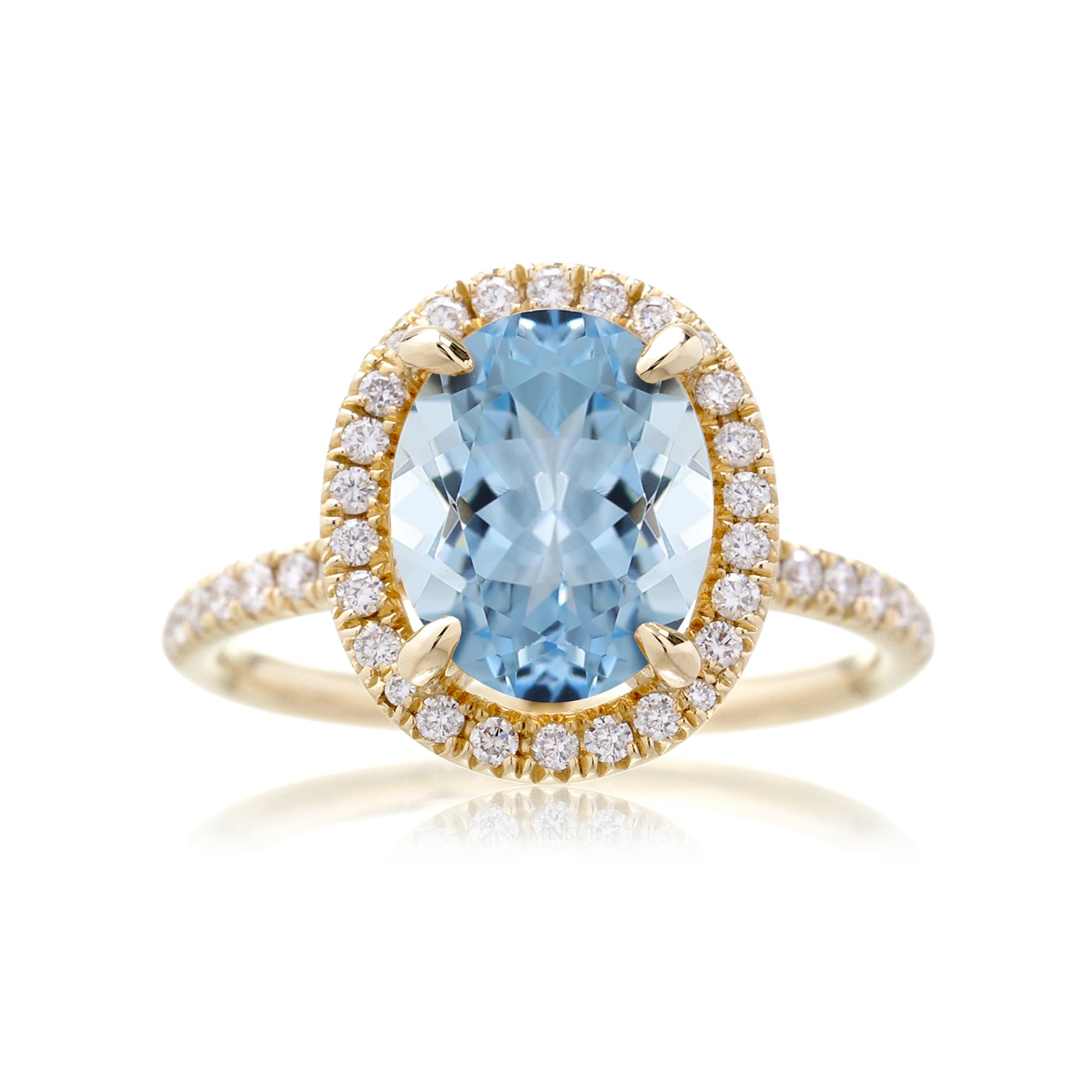 Oval aquamarine engagement ring with diamond halo the Drenched yellow gold