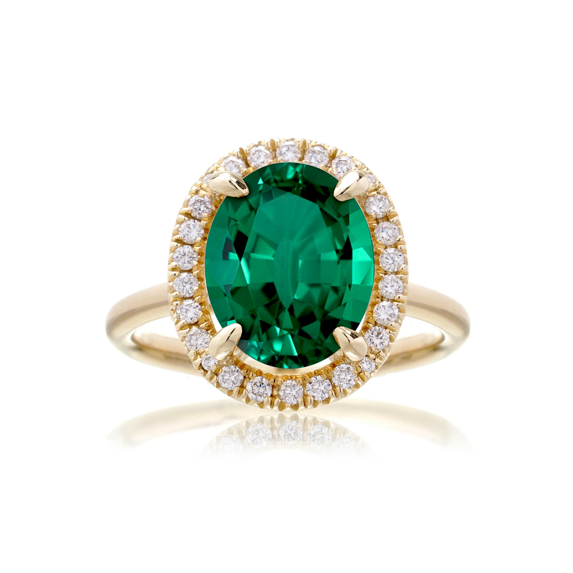 Oval cut emerald engagement ring with diamond halo the Drenched yellow gold solid band
