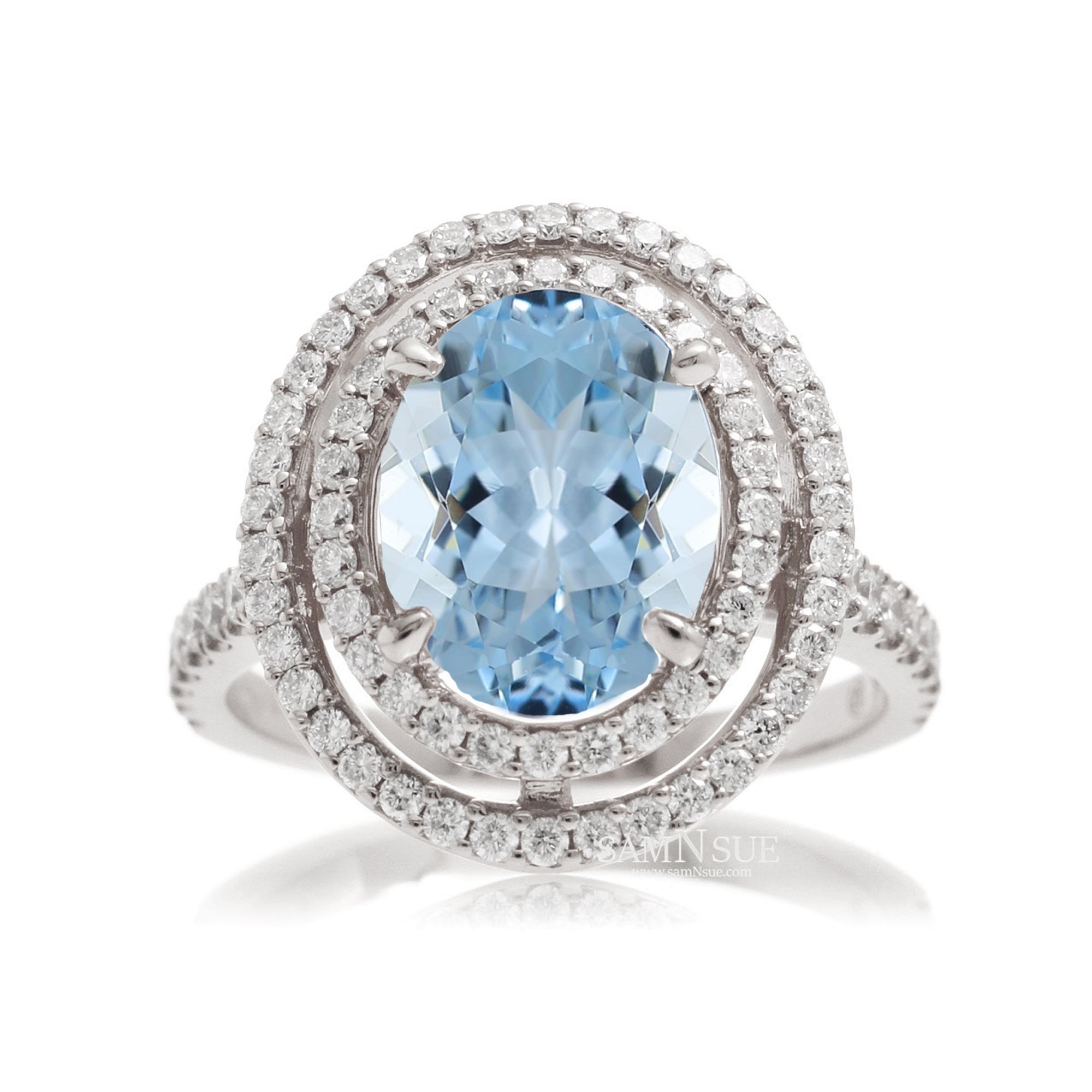 Oval cut aquamarine ring with double halo diamond band in white gold