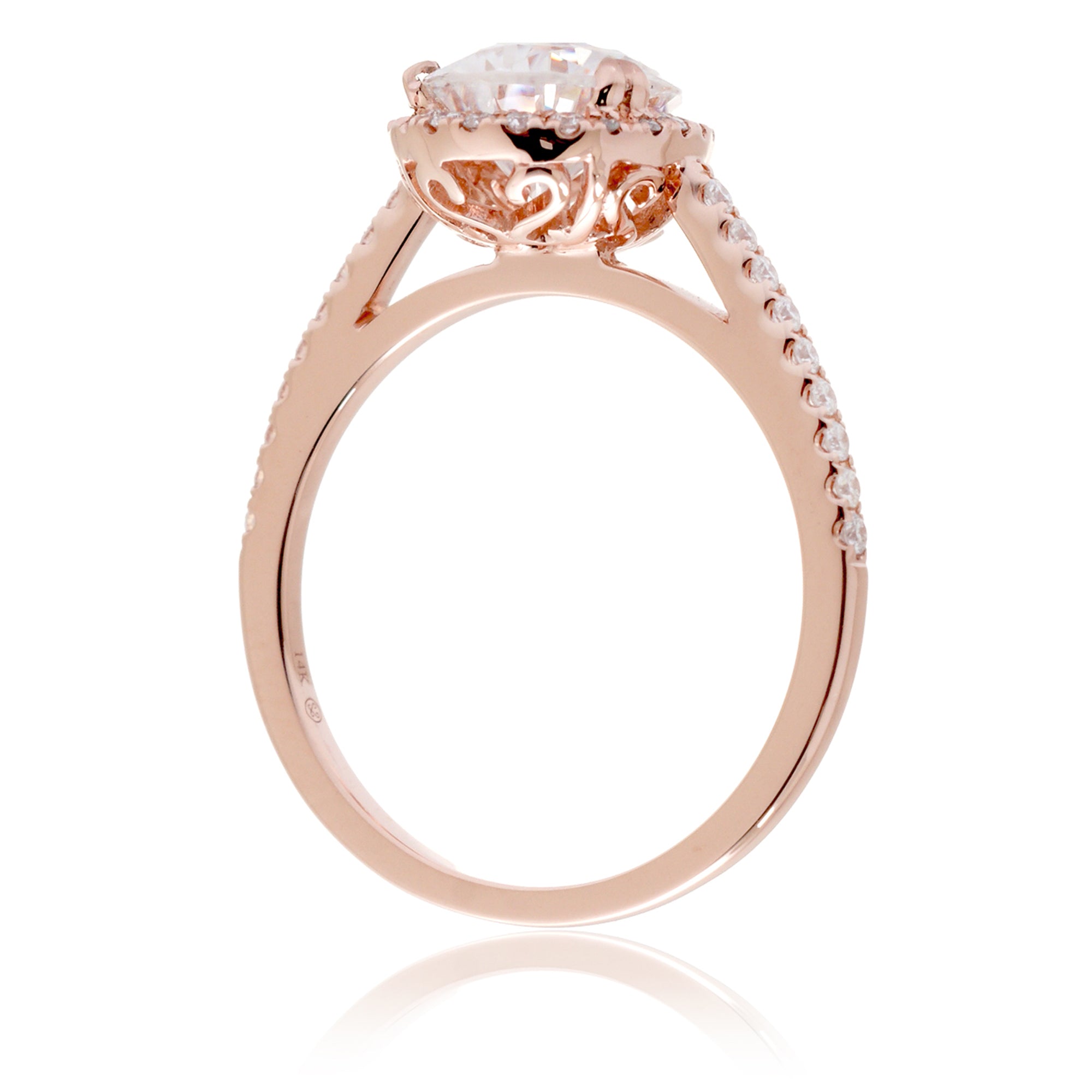 Pear moissanite and diamond halo ring in the signature rose gold
