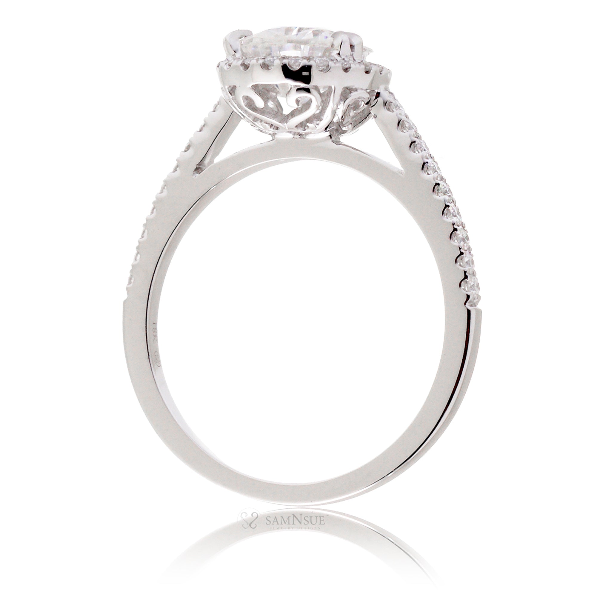 Pear moissanite and diamond halo ring in the signature white gold