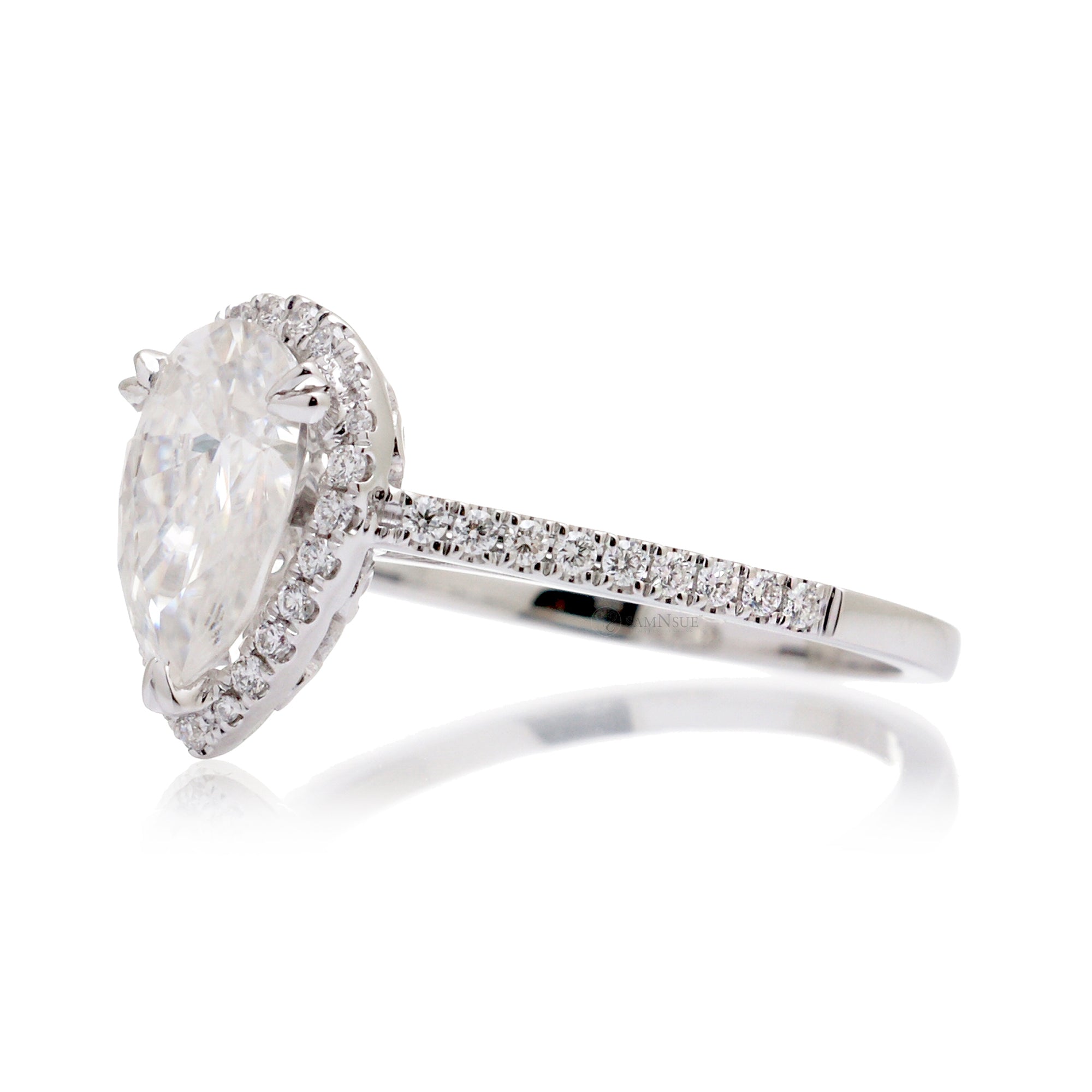 Pear moissanite and diamond halo ring in the signature white gold