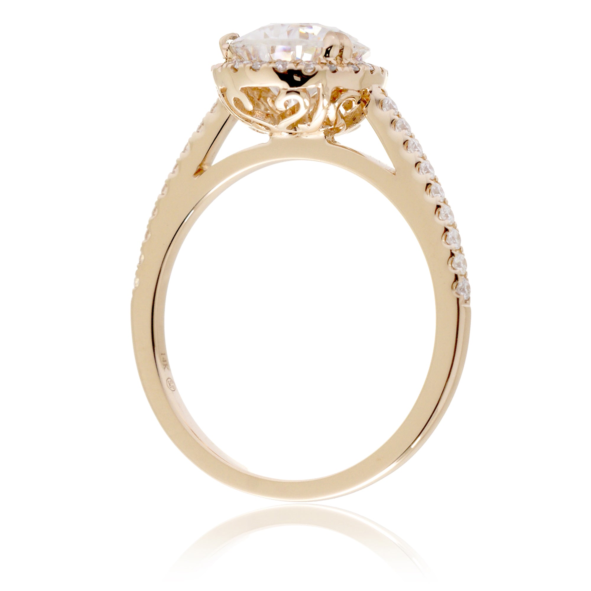 Pear moissanite and diamond halo ring in the signature yellow gold