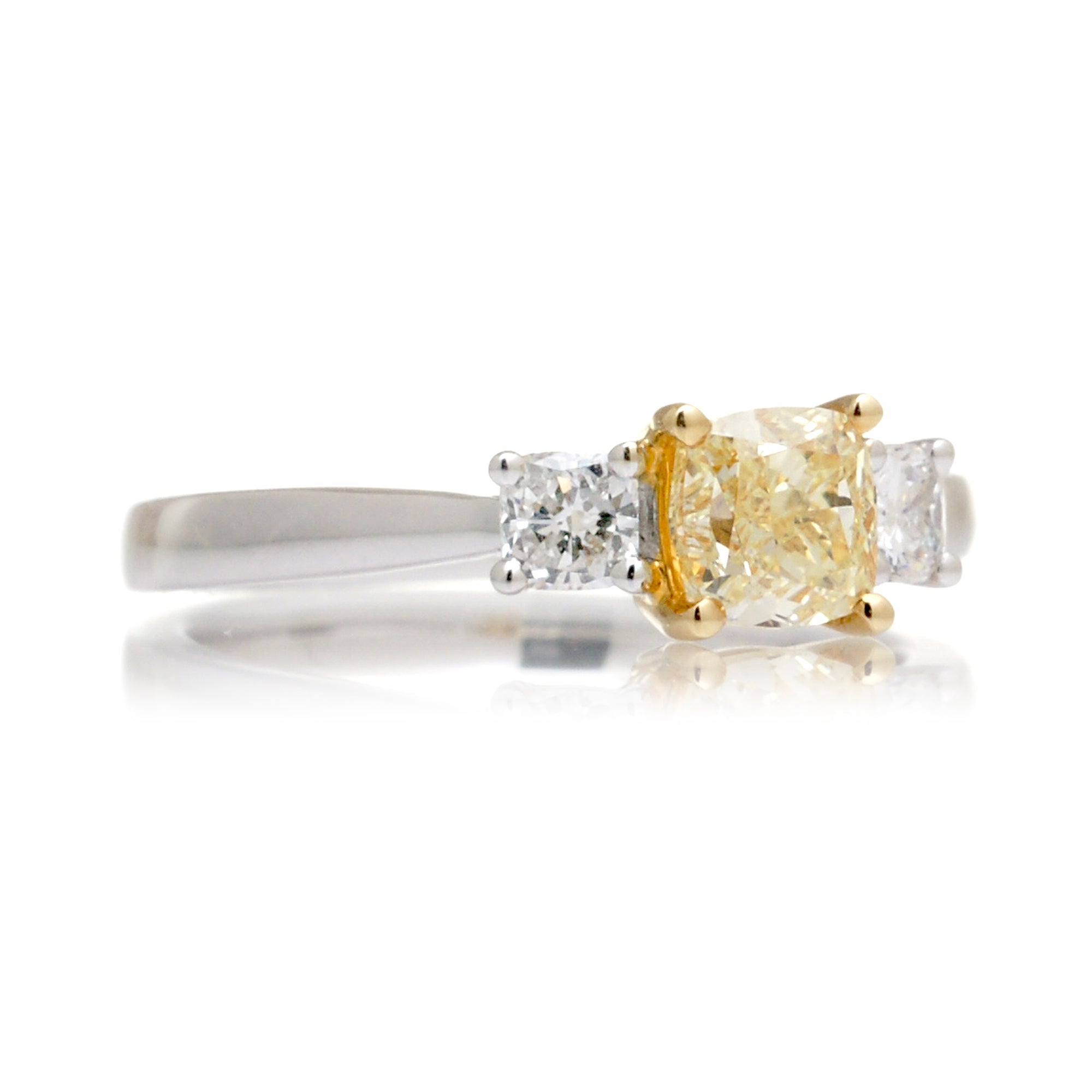 Fancy yellow color natural cushion diamond three stone engagement ring