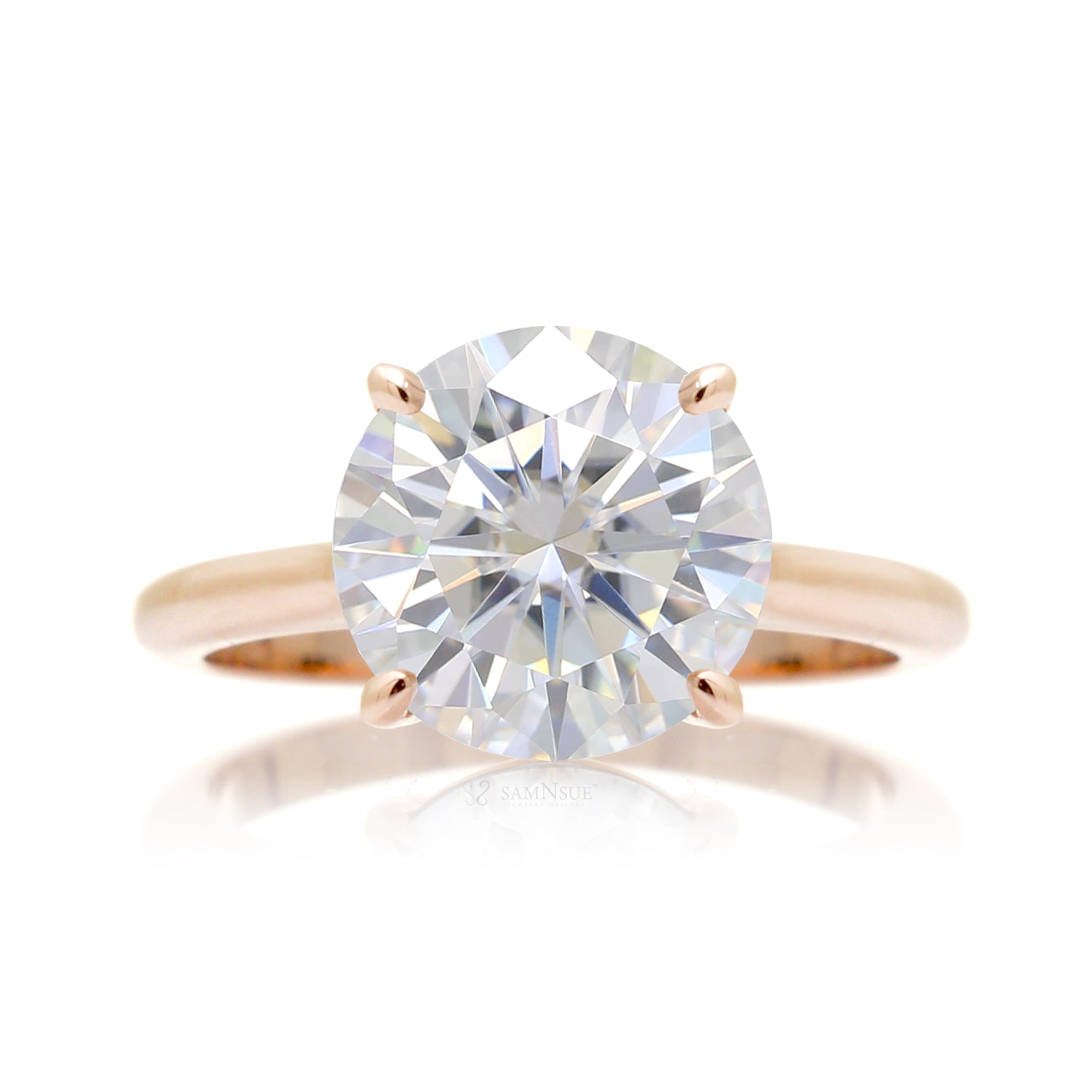 Round solitaire moissanite engagement ring in rose gold
