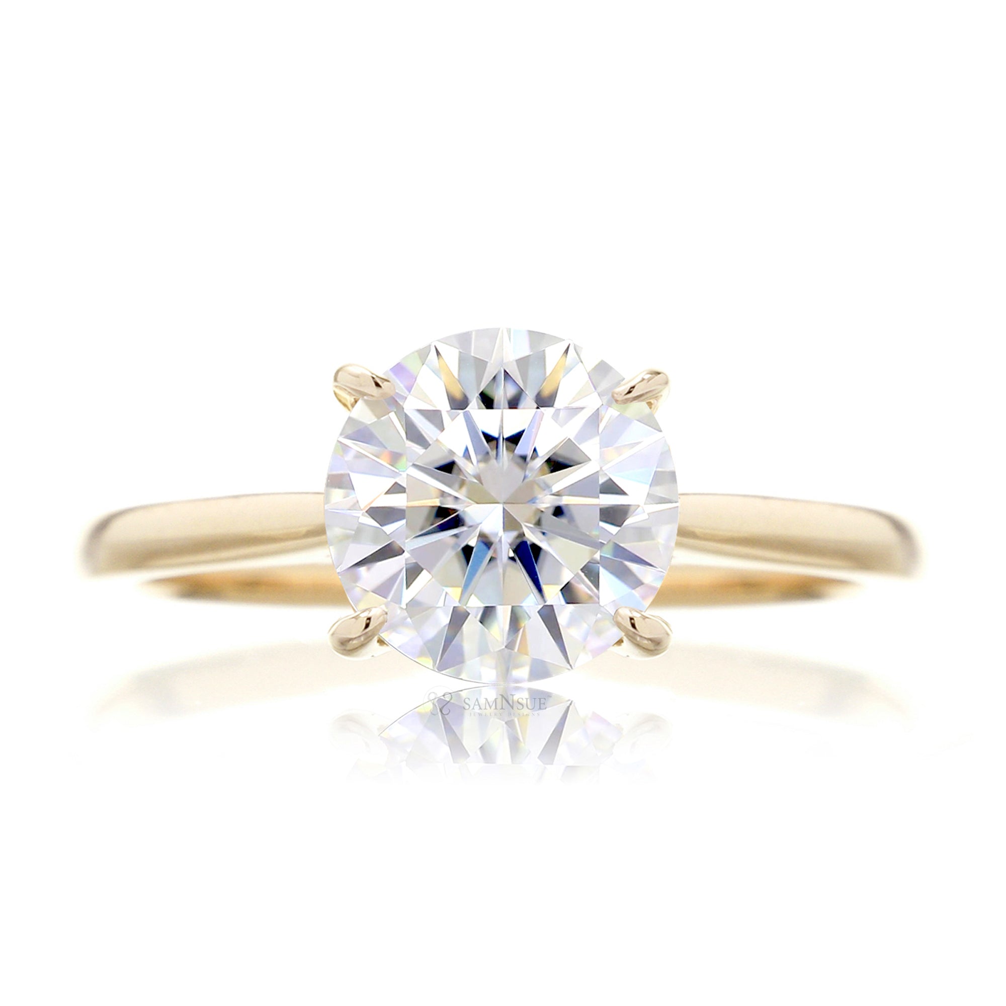 Round solitaire engagement ring in yellow gold