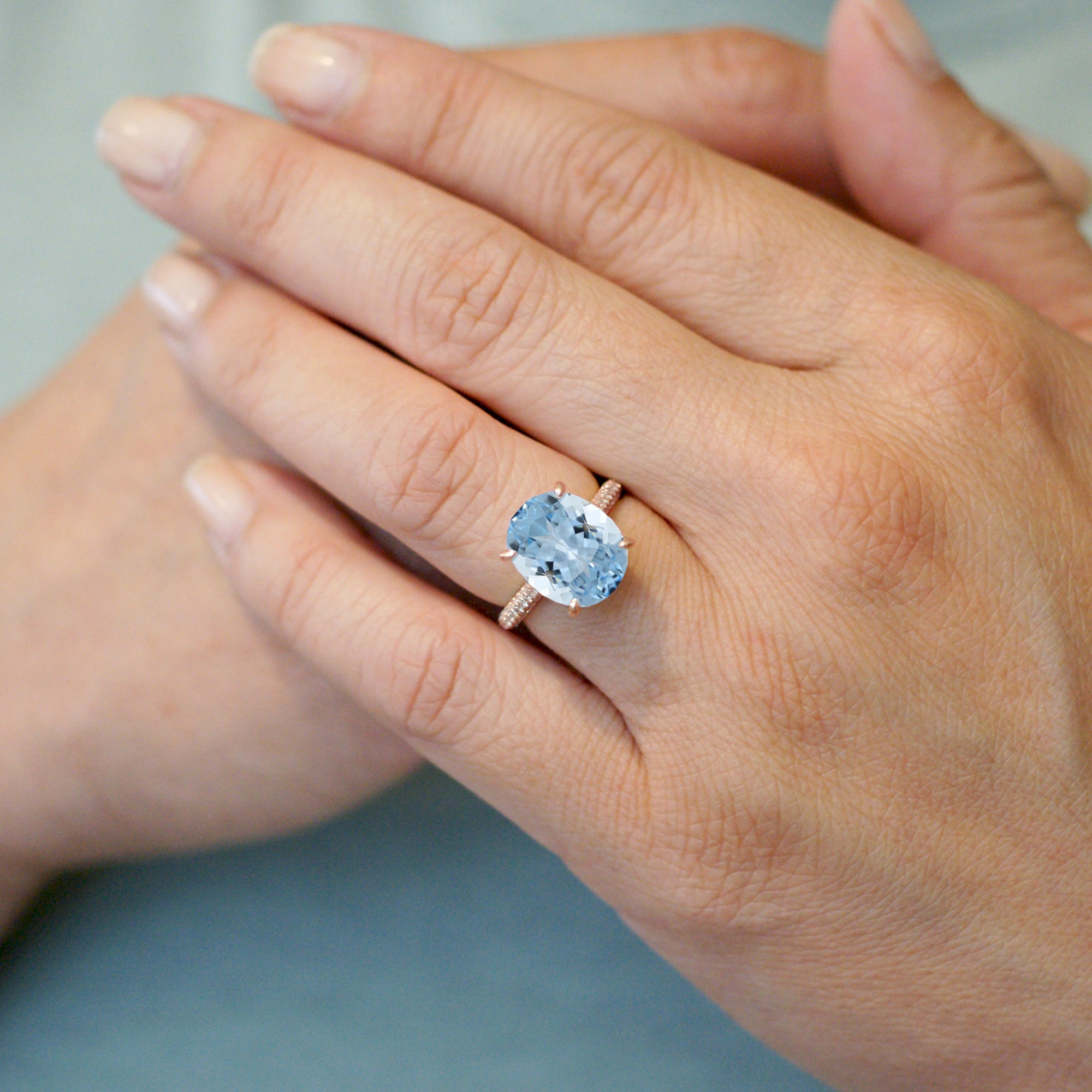 Oval cut aquamarine diamond solitaire pave engagement ring in rose gold