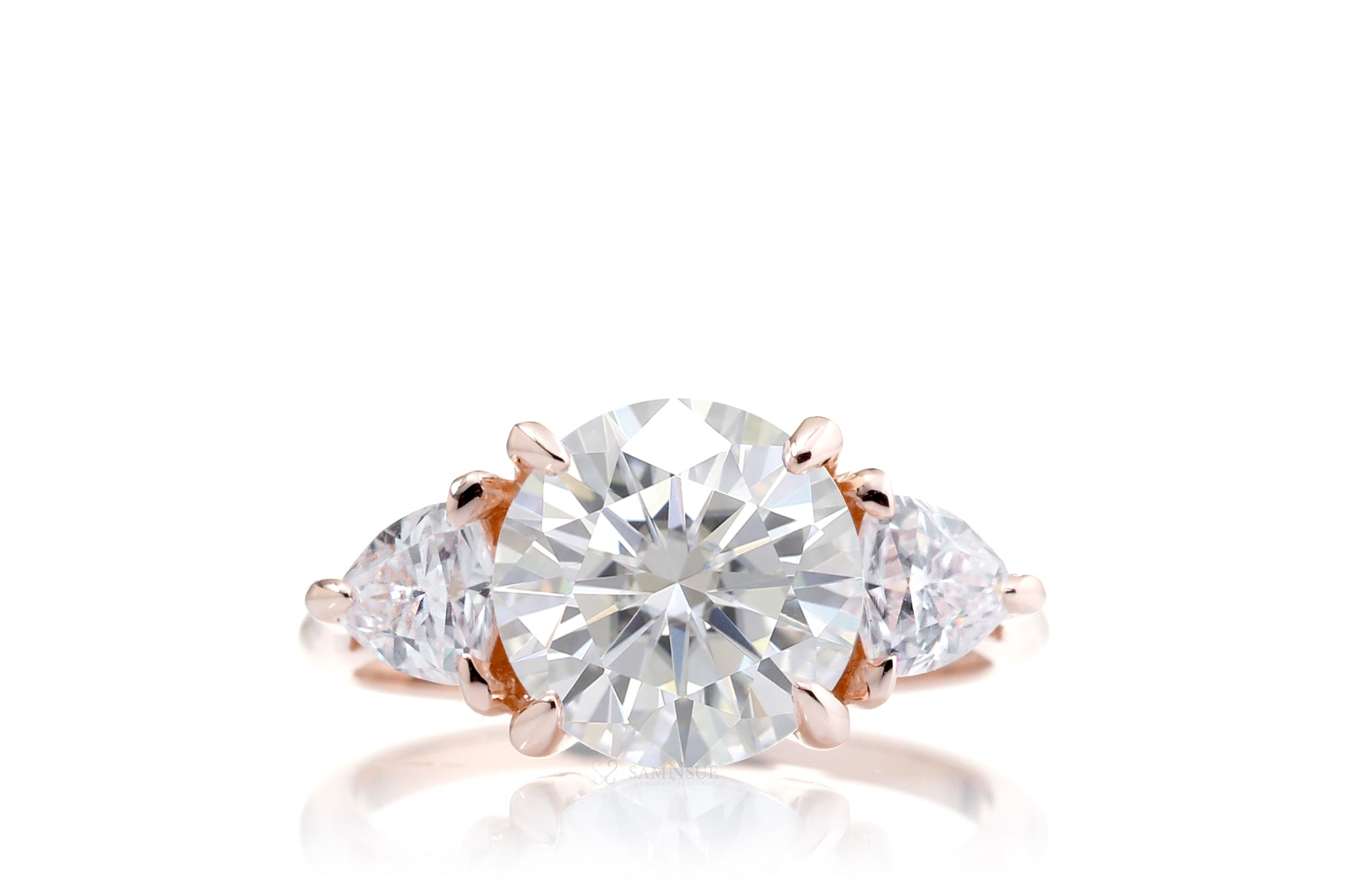 The Trillion Three stone Round Moissanite Ring
