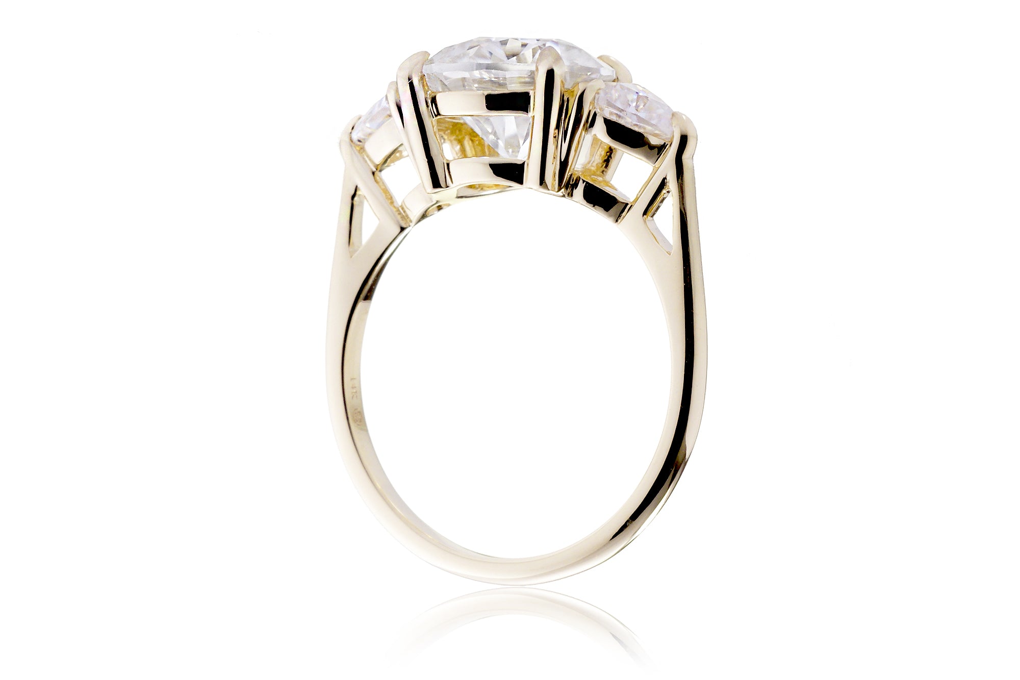 The Trillion Three stone Round Moissanite Ring