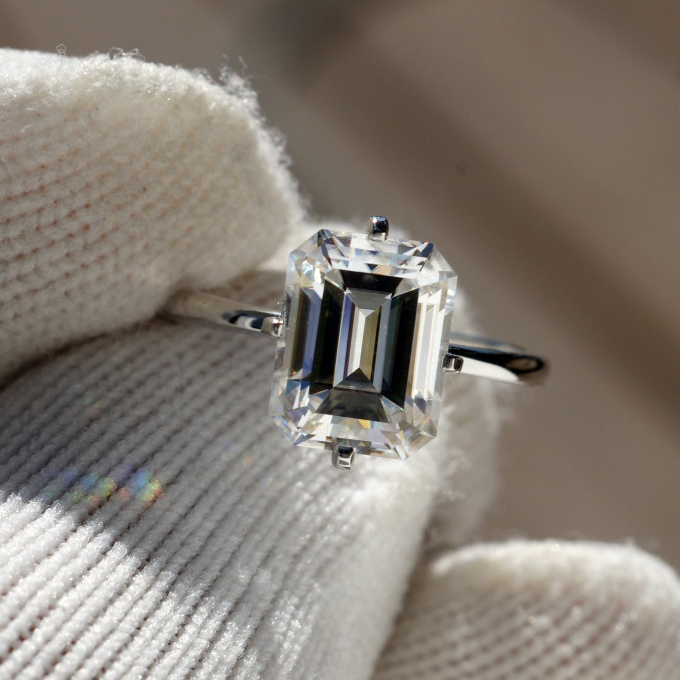 The Adeline Emerald Cut Moissanite 9x7mm 18k white gold