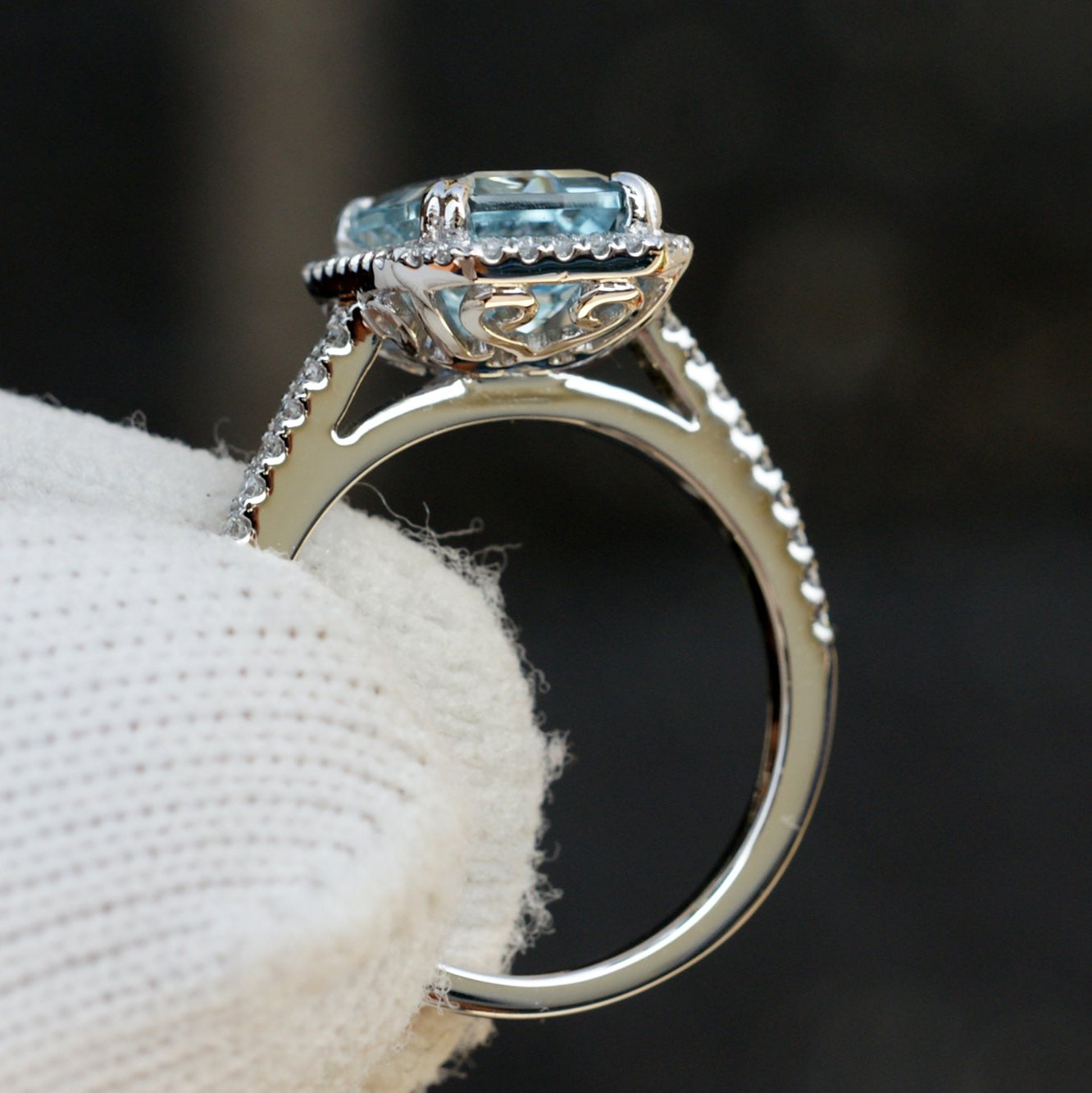 Emerald cut aquamarine engagement ring with diamond halo in white gold