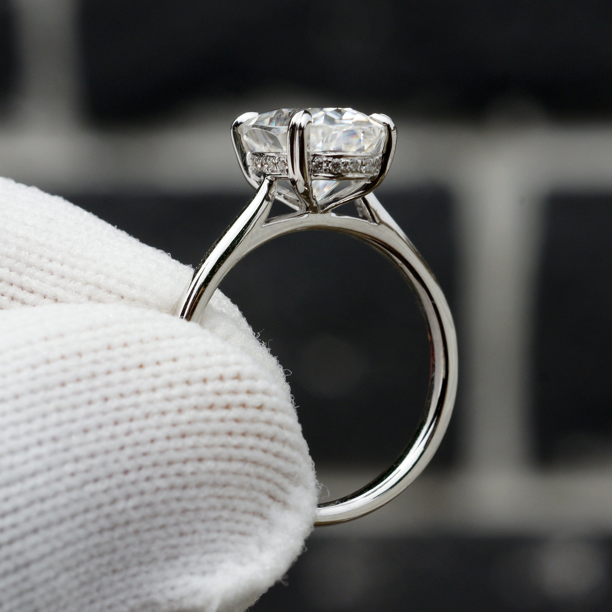 Elongated oval moissanite solitaire hidden halo ring