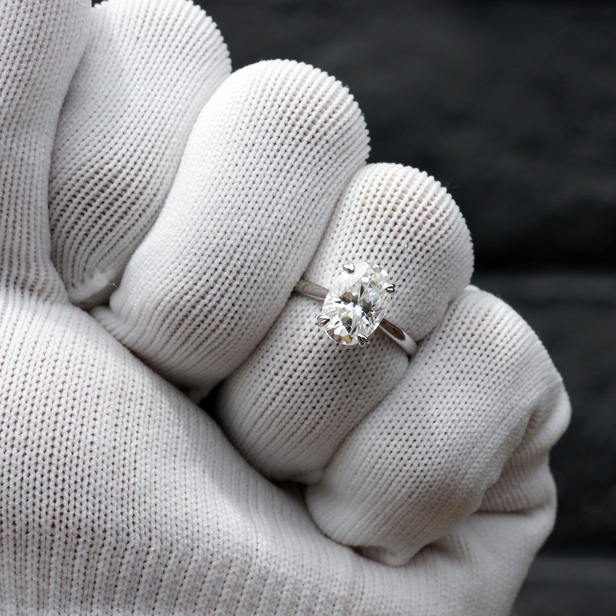 Elongated oval moissanite solitaire hidden halo ring