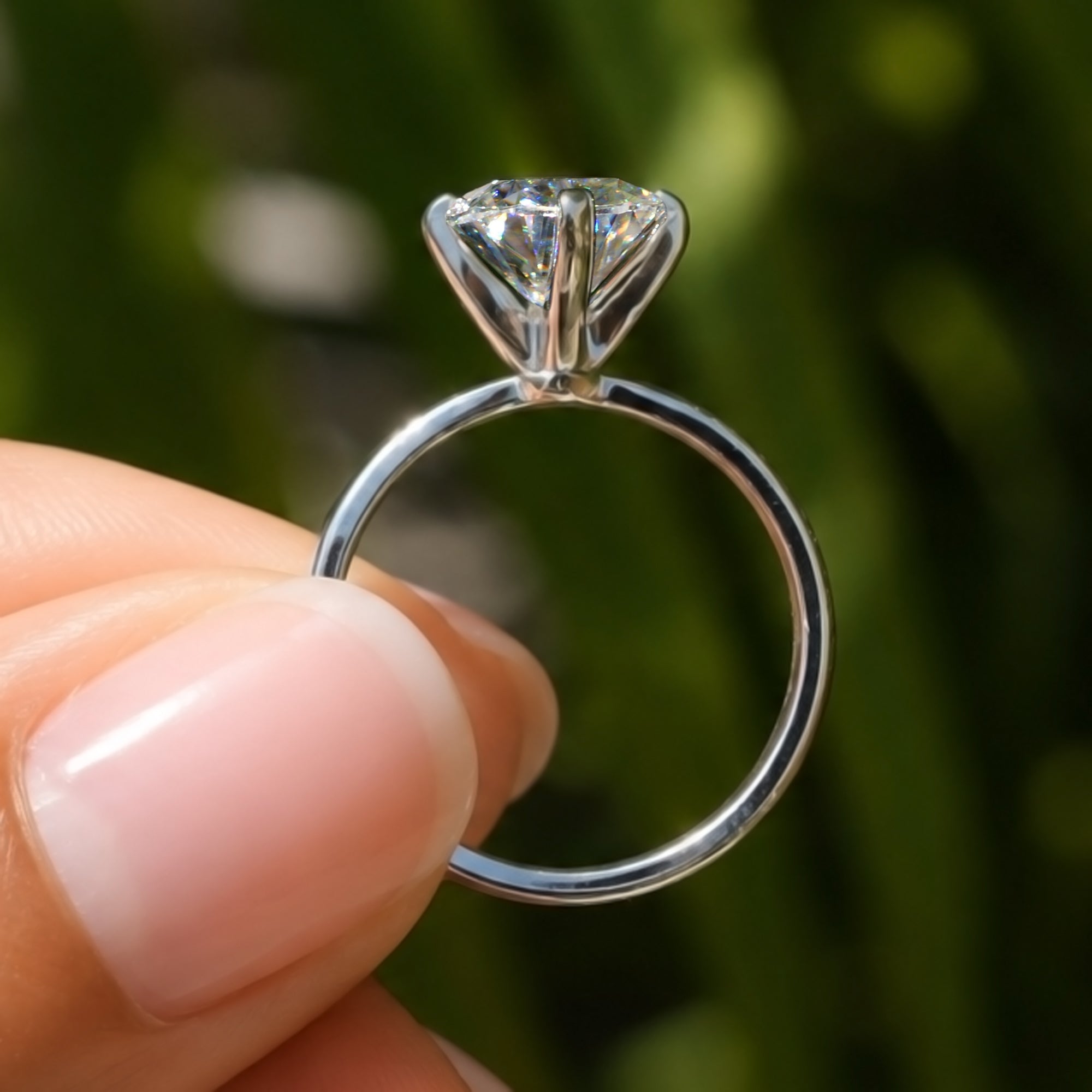 The Adeline Cushion Moissanite 10x8mm middle prongs