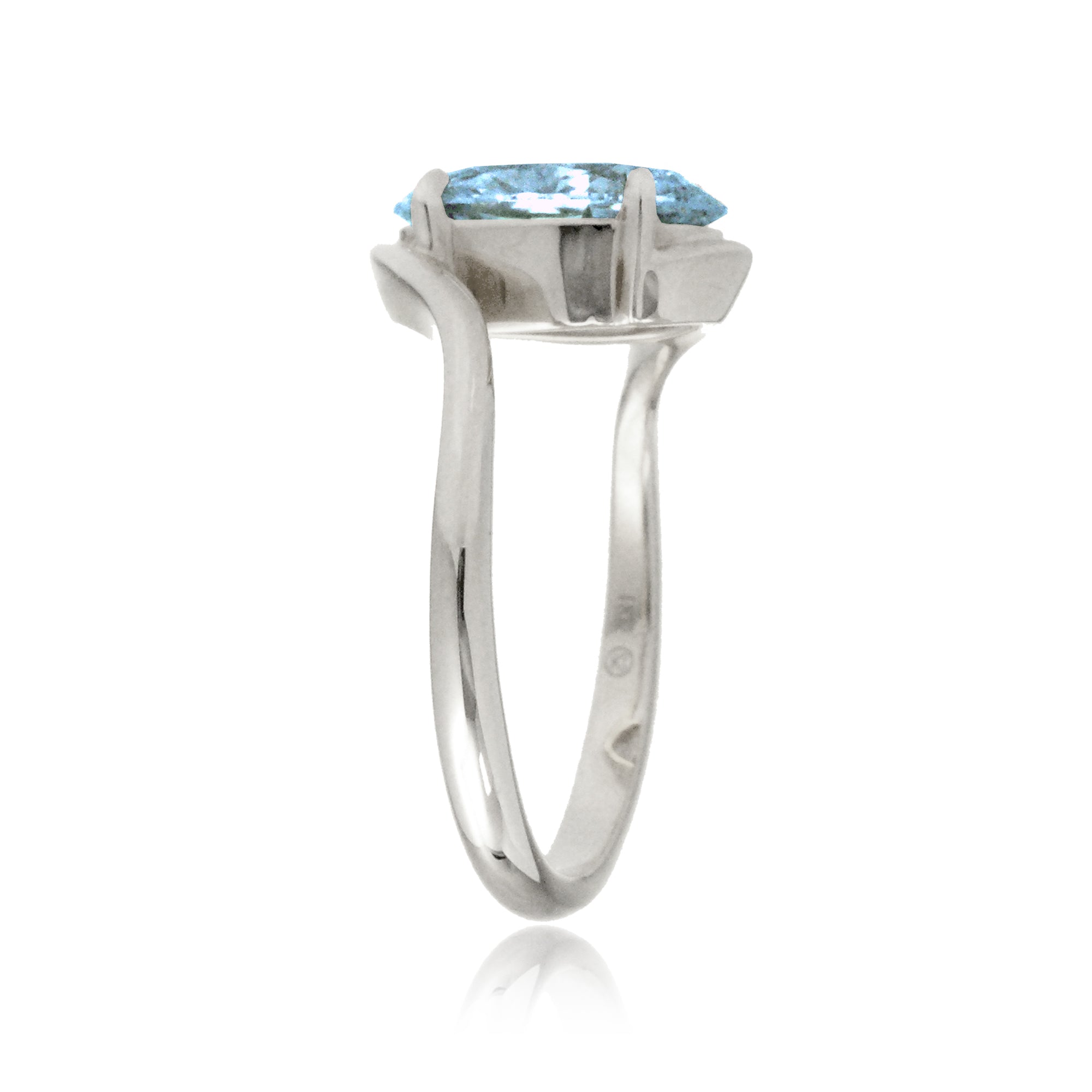 Oval cut aquamarine ring embraced wrap around white gold solitaire