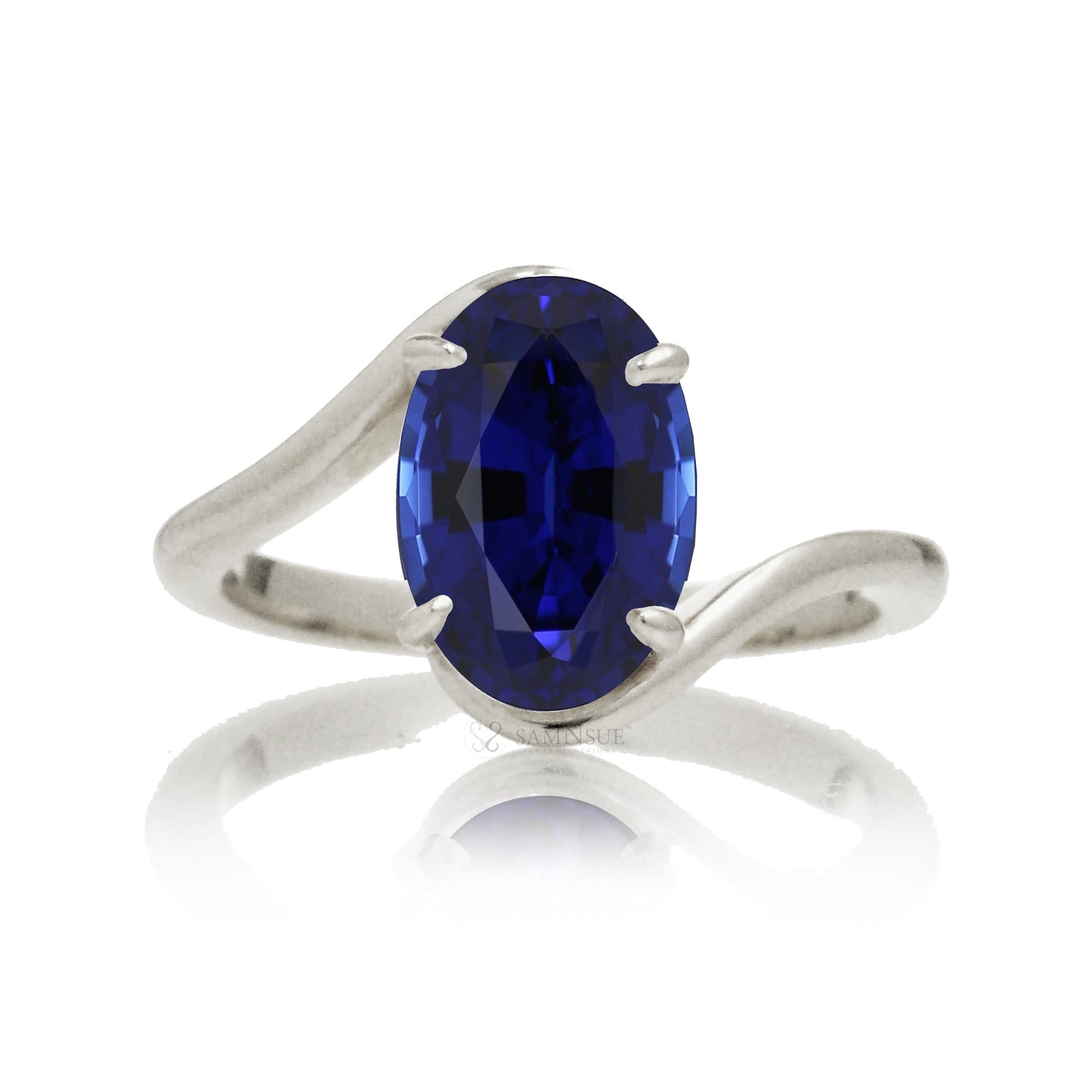 Oval blue sapphire ring in a modern bypass setting with white gold band