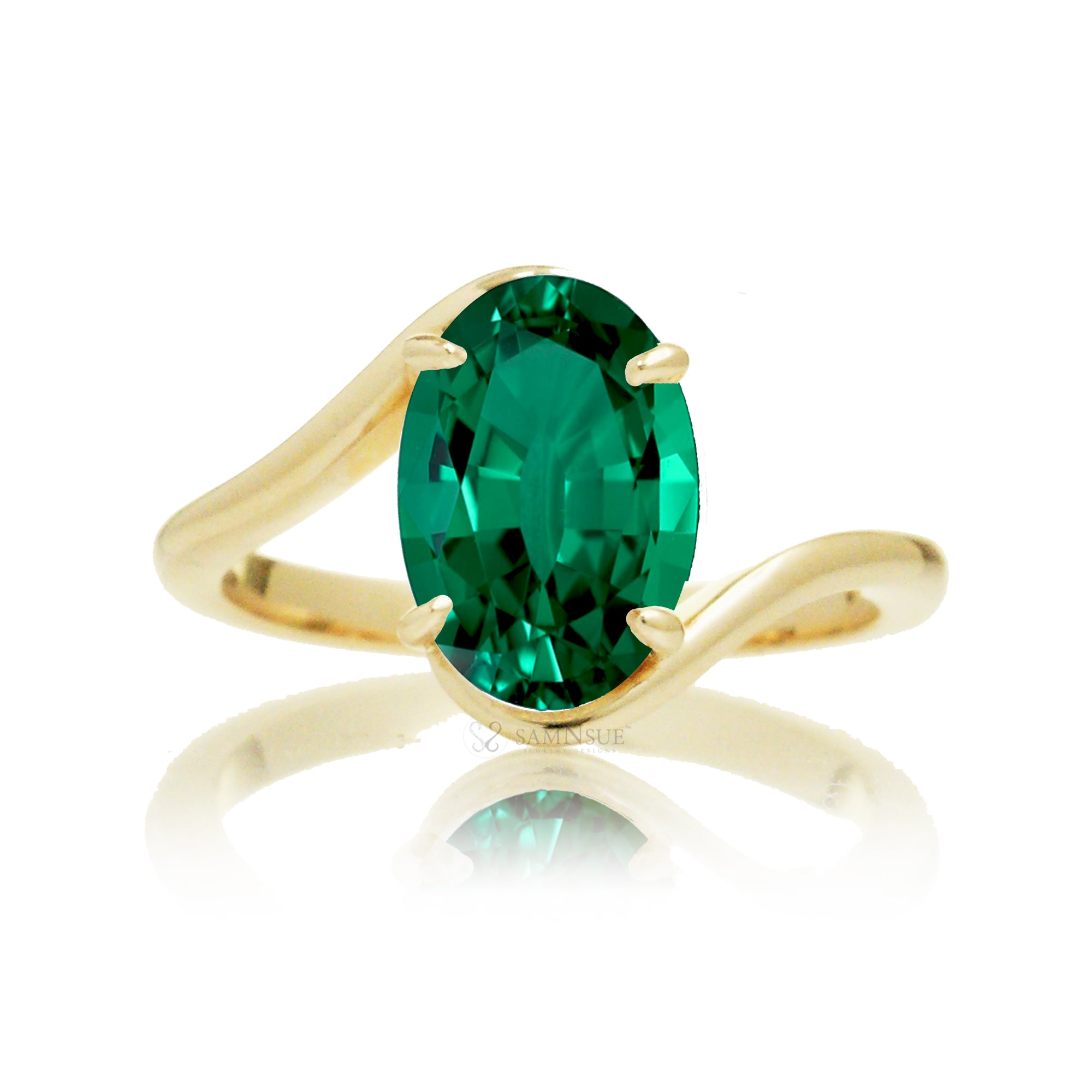 Elegant yellow gold bypass ring featuring an oval-cut emerald