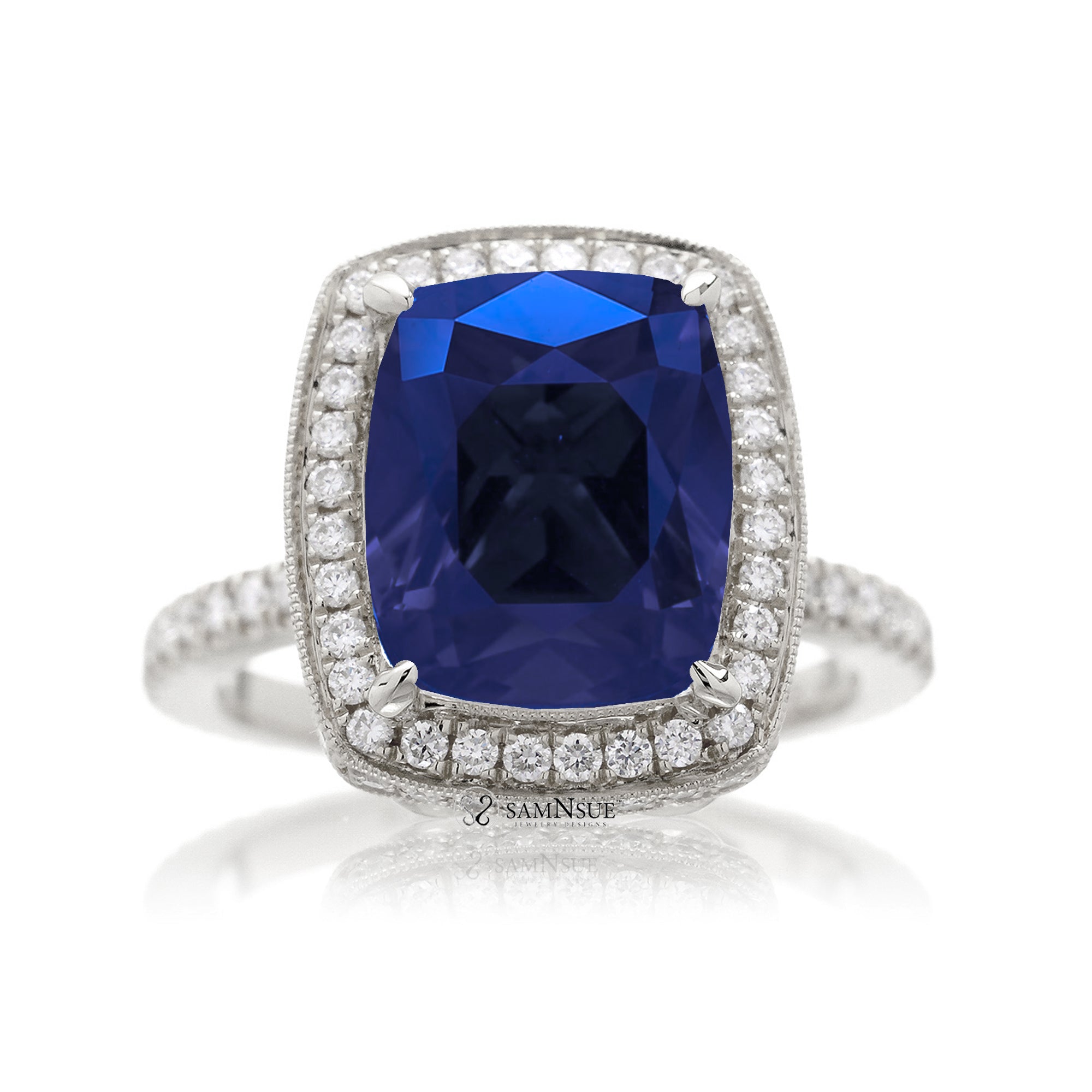 Cushion sapphire engagement ring with vintage scrolls and diamond accent white gold
