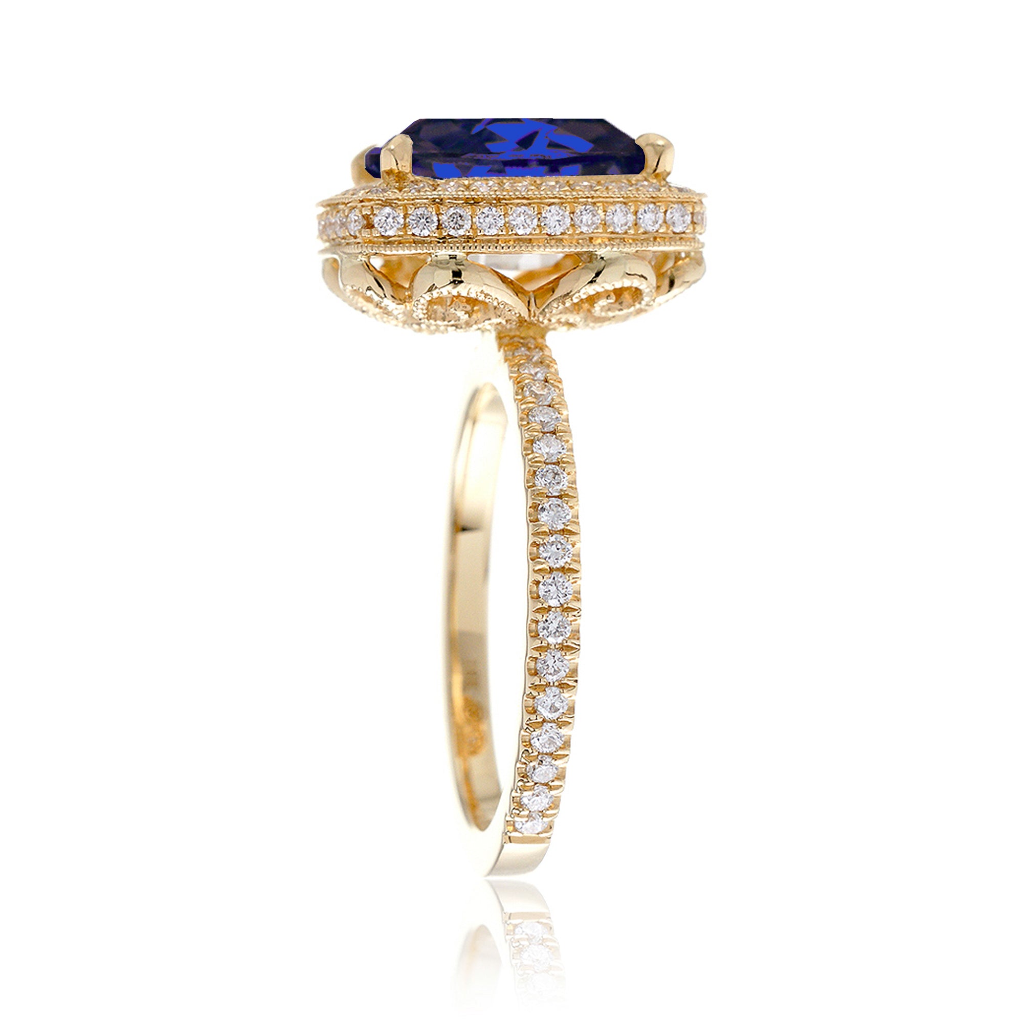 Cushion sapphire engagement ring with vintage scrolls and diamond accent yellow gold