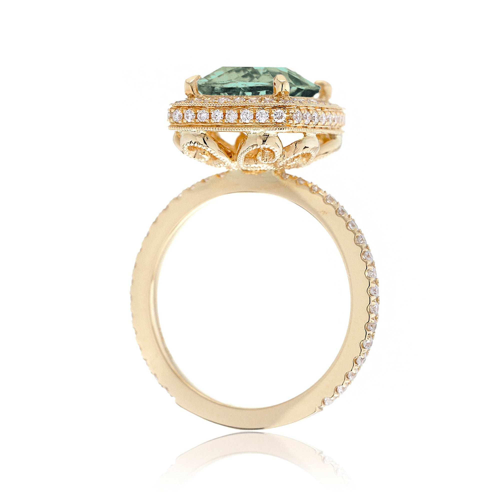 Cushion green sapphire engagement ring with vintage diamond halo and setting yellow gold